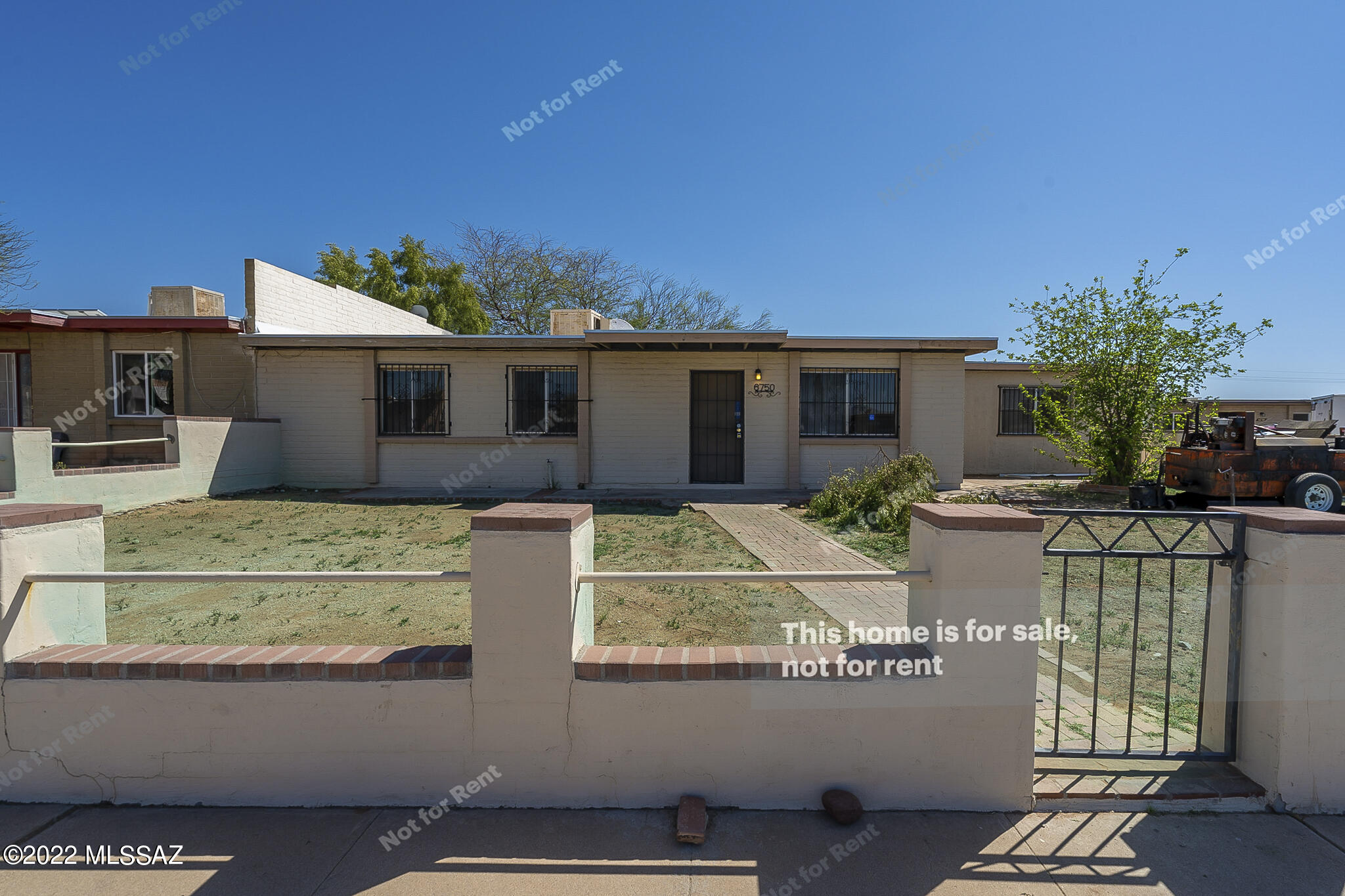 Fantastic 3 bedroom home in sought after Tucson location. The impeccable kitchen has beautiful counters, generous cabinet space, and modern appliances. Lighting, ceiling fans, and fixtures throughout, giving you luxurious amenities that make this home more comfortable. This home has a luxurious primary suite, complete with an en-suite bathroom. Entertain on the covered back patio, perfect for barbecues. Don't wait! Make this beautiful home yours today. This home has been virtually staged to illustrate its potential.