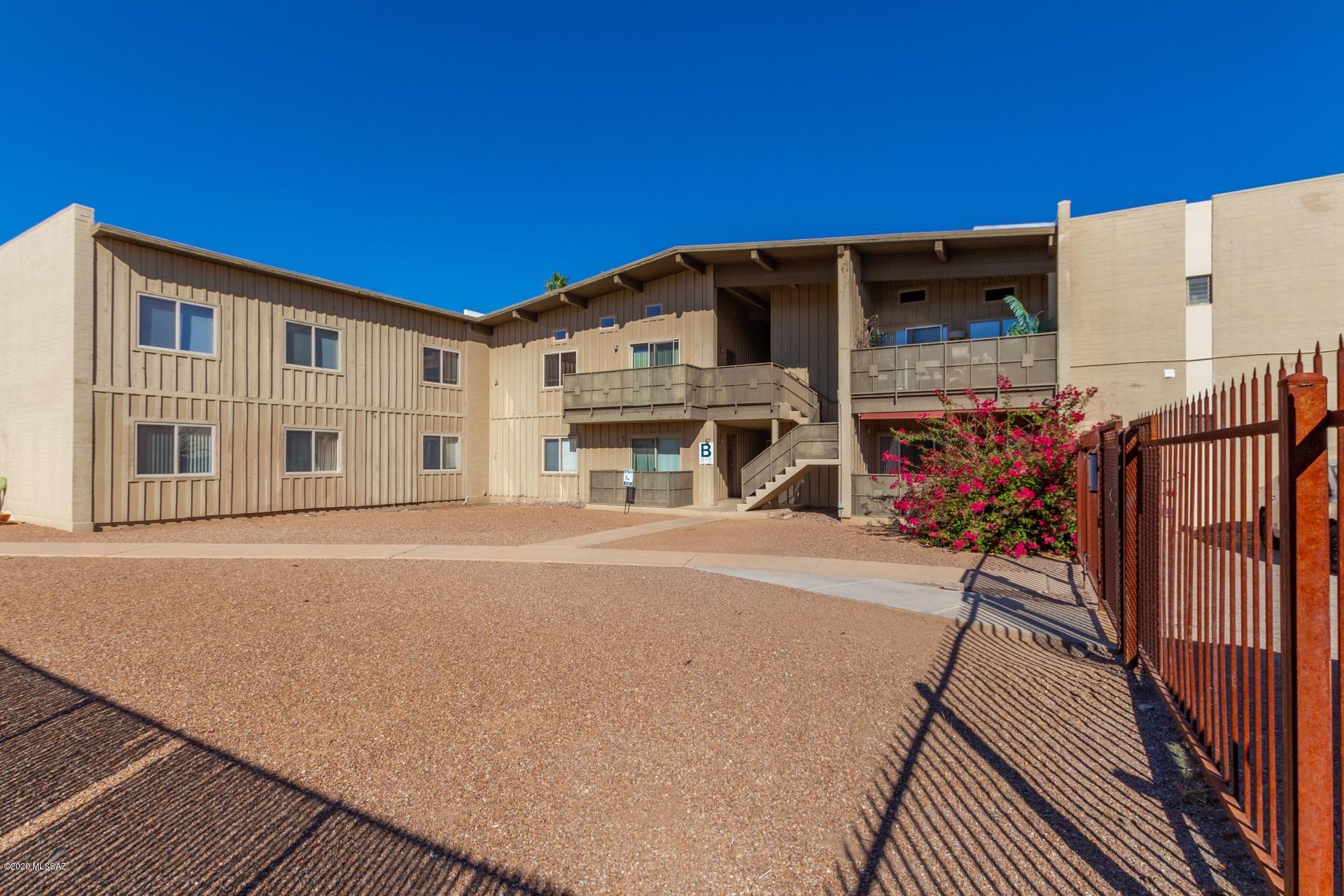 Welcome to the gated community of Royal Alvernon. Spacious open condo w/painted vaulted wood ceiling, upgraded lighting, neutral tile floor, warm palette, ceiling fans, window blinds, & private balcony. Beautiful wood kitchen cabinets, pantry,  & stylish counters. Interior laundry closet w/stacked washer/dryer.  Plush carpet in bedroom, two large closets, &  updated bath w/beautiful tile & vanity.  Community pool! Convenient location to everything!  Take a tour & stop renting!