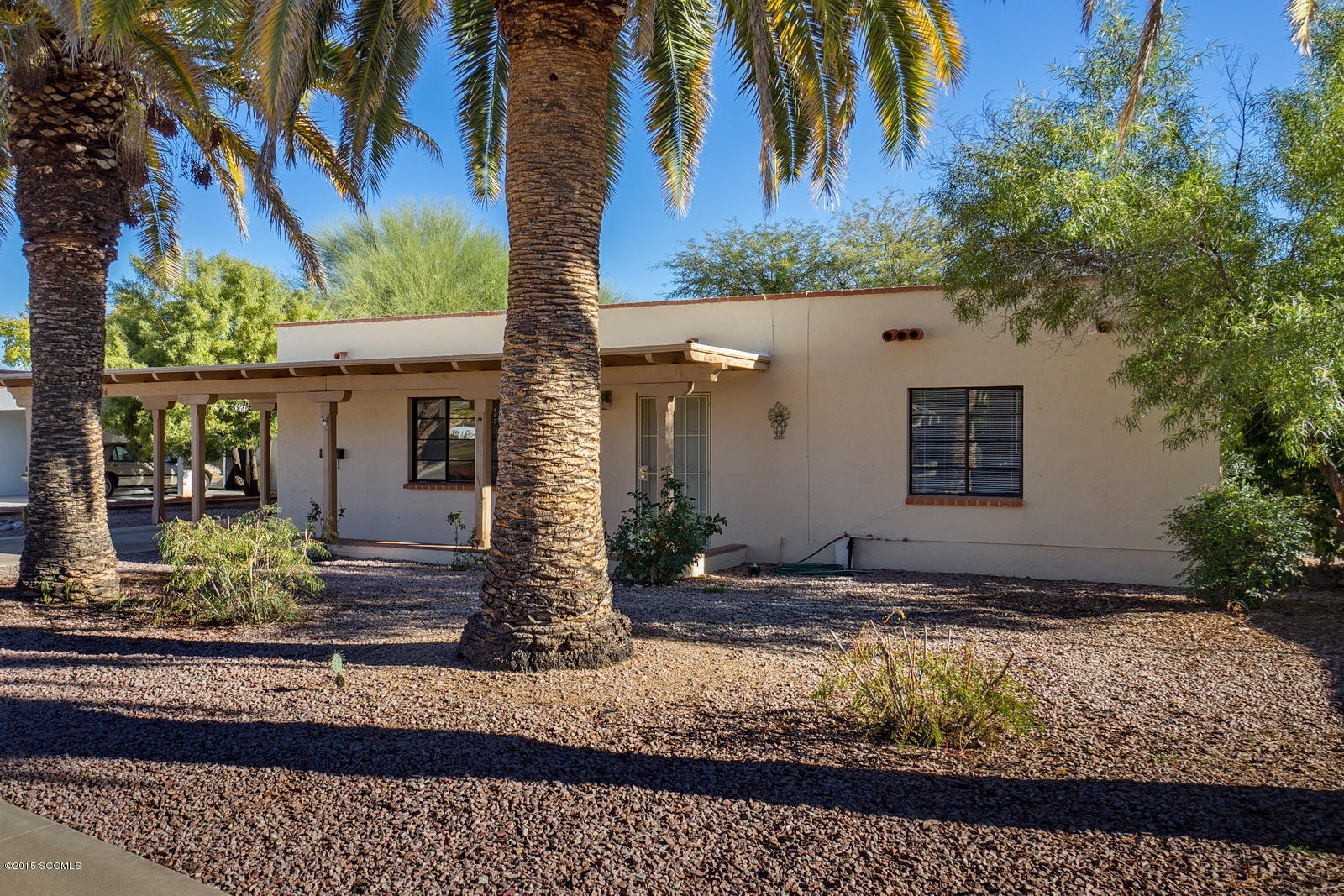 In an established neighborhood with mature vegetation is this single family home with 1410 SF. Location is great! Close to golfing, highway access, dining and shopping! In addition to the two bedrooms and two baths, there is a large Arizona room accessible through the dining area.