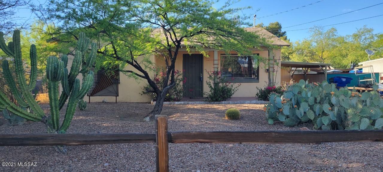 Adorable, clean and well-maintained central 1948 bungalow close to UofA, Banner Medical Center, Loft Theater, Casa Video and Whole Foods, among other amenities. Master bedroom with separate exterior entrance perfect for work-from-home office or workspace. Open, eat-in kitchen with room for table and chairs. Authentic stained concrete and wood parquet floors, charming archways and details. Lush desert and low-water landscaping. Newer roof and heating/AC. Master shower grey water system irrigates landscaping. Welcoming front porch, deep back porch, and rustic free-standing ramada with built-in wood-burning grill for summer evening dinners.