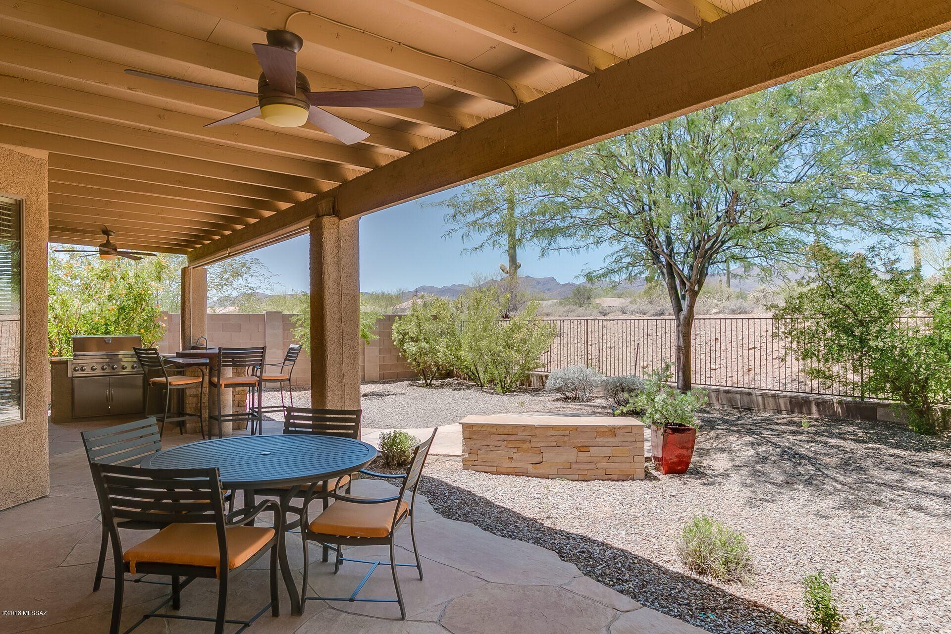 Pristine 3 BR + Den in Gated Rancho Agua Dulce. Gorgeous Yard with Mountain Views! 8' Slider opens to broad Covered Porch with lighted Ceiling Fans sheltering a Rock-faced Outdoor Kitchen with a Gas Rotisserie BBQ, Flagstone Patios and Sun Shades. Lovely Landscaping includes a Lime Tree for your Margaritas! There's an additional Flagstone Patio with a Rock-faced Bench.  Stainless Steel Cook's Kitchen: Glass Mosaic full Backsplashes, Maple Cabinetry, under-cabinet lights, Gas Stove & generous Island. French Doors open to Den off Great Room. This Immaculate Home has wonderful natural light. All Designer Lighting & Ceiling Fans. Romantic Master: 8' Slider to Yard, Garden Tub, sep Shower. Stucco, Trim & Gates painted 2017. New Carpet 2018. Large Epoxy-floored Garage w/ Utility Sink, Storage.