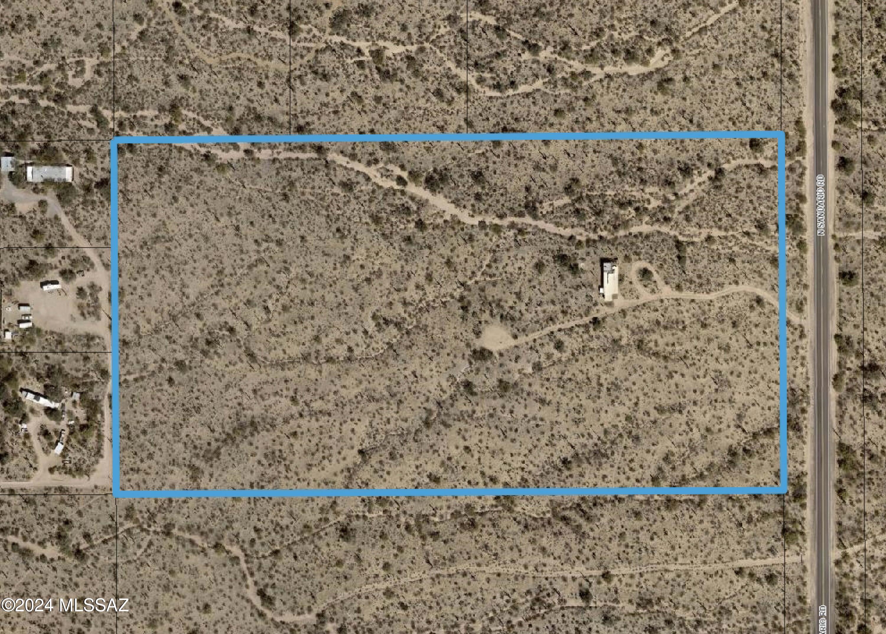 Almost 19 acres of land directly across from Saguaro National Park West on Sandario Road with an existing manufactured home (MH) that is being sold as-is, where-is (see documents). Existing water meter & electric meter. Septic system in place but not functional  Water well on property will convey but hasn't been used in decades. RH Zoning. Former rooftop deck provided spectacular 360 degree views and incredible starry night skies. Existing owner developed trails throughout the property. MH has not been occupied for several years, and the rooftop deck is no longer accessible and needs repairs.  Adjacent 28+ acres is also available.