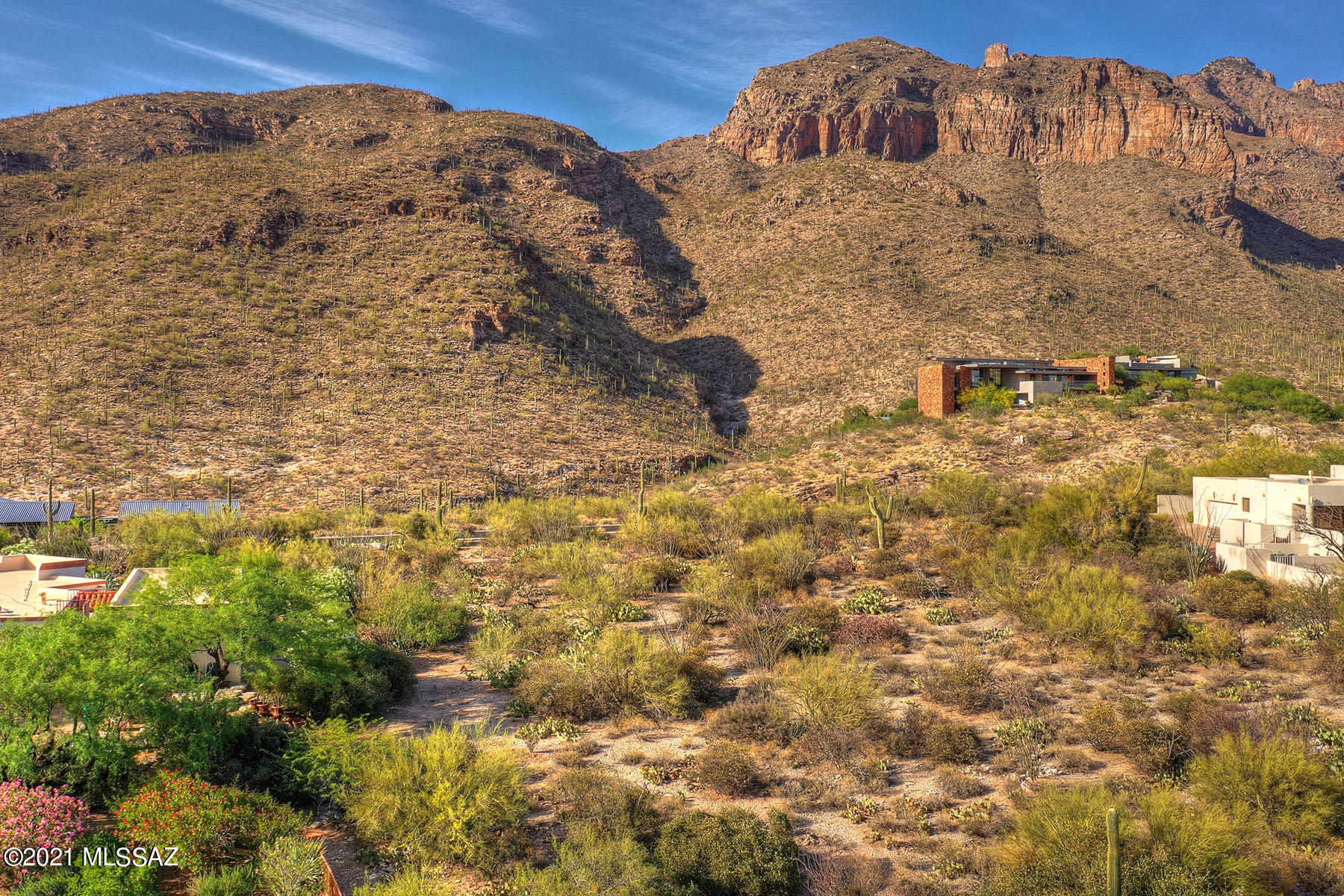 Extraordinary View Lot located in exclusive Cobblestone, the coveted guard-gated community high at the top of Campbell Ave. Ready to build your dream home on almost an acre of land with the ideal North/South orientation. This lot truly boasts Unobstructed and Panoramic VIEWS of the Catalina Mountains + the twinkling city lights. Extremely buildable lot. Lush natural desert setting captures the ambiance Tucson is famous for. One of the last great lots in the area. All utilities to lot line. Conveniently located in the center of the foothills just minutes to La Encantada Mall, top restaurants, world-class golf resorts & clubs, cycling, hiking trails, University of Arizona and much more.