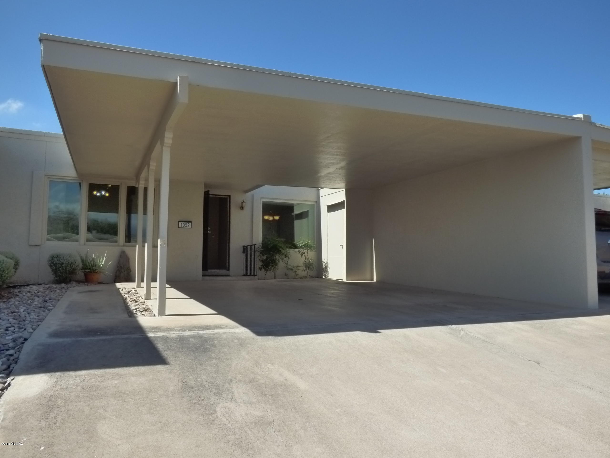 Here's an awesome opportunity in a wonderful Tucson community with a community pool and low HOA fees. This 2 bedroom, 2 bath, 1330 square foot townhouse with a 2 car carport is ready for its next owner to create their vision. Includes a nice efficient floor plan, mountain views, a tranquil covered back patio, dual pane front windows and lots of storage. The seller considered putting in new carpet and painting the inside, but decided to sell ''as-is'' and let the new owner make changes.  the refrigerator, washer and dryer are included. The dishwasher has not been used in a long time, and might not work. The HOA will not allow this home to be rented by the next owner.