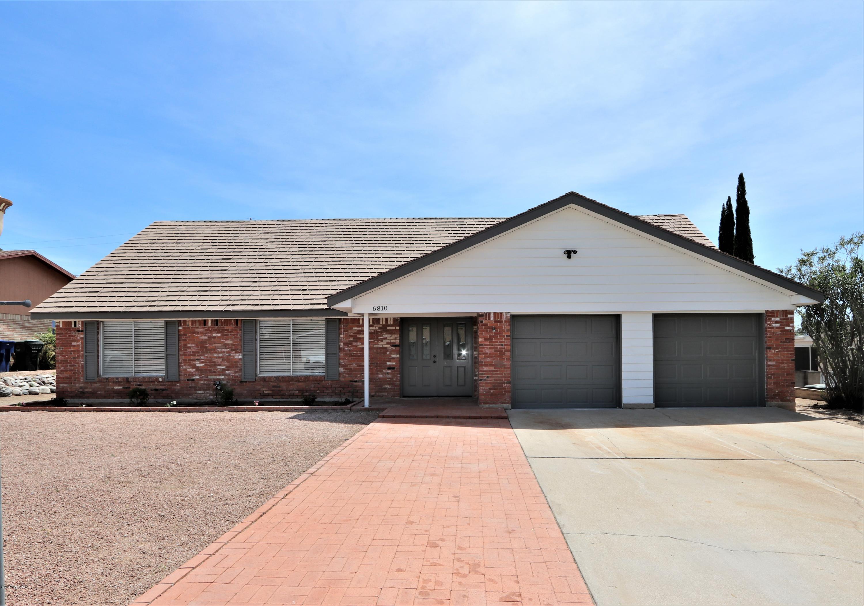 Exceptional 2 story 6 bedroom 2 bath home in a nice quiet cul de sac in popular East side Tucson. Enjoy the large backyard with sparkling pool and extended covered patio. Soothing fireplace in living area, chic tile accents throughout.  A must see! Agent owned.
