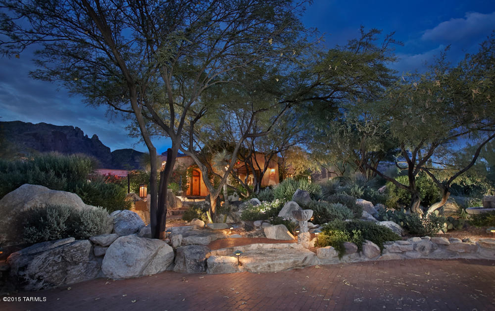 An authentic Spanish Colonial of museum quality for the most discriminating connoisseur.  This enchanting Hacienda in Tucson’s premier gated community backs up to the National Forest & has panoramic mountain & city views. The interior was designed by the legendary Hollers & Saunders incorporating antique, reclaimed & handcrafted materials from around the world. Each unique item including historic timbers & aged hardwood floors, were specifically selected & handcrafted for “Hacienda Rosetta Marie”. Renowned architect Larry Pearson headed the architectural team to not only create an unsurpassed home, but a walk through time into a Spanish Colonial masterpiece.  Privacy abounds from this 1.6ac lot with abundant desert growth, Mediterranean courtyards, lush patios, pools & tinkling fount