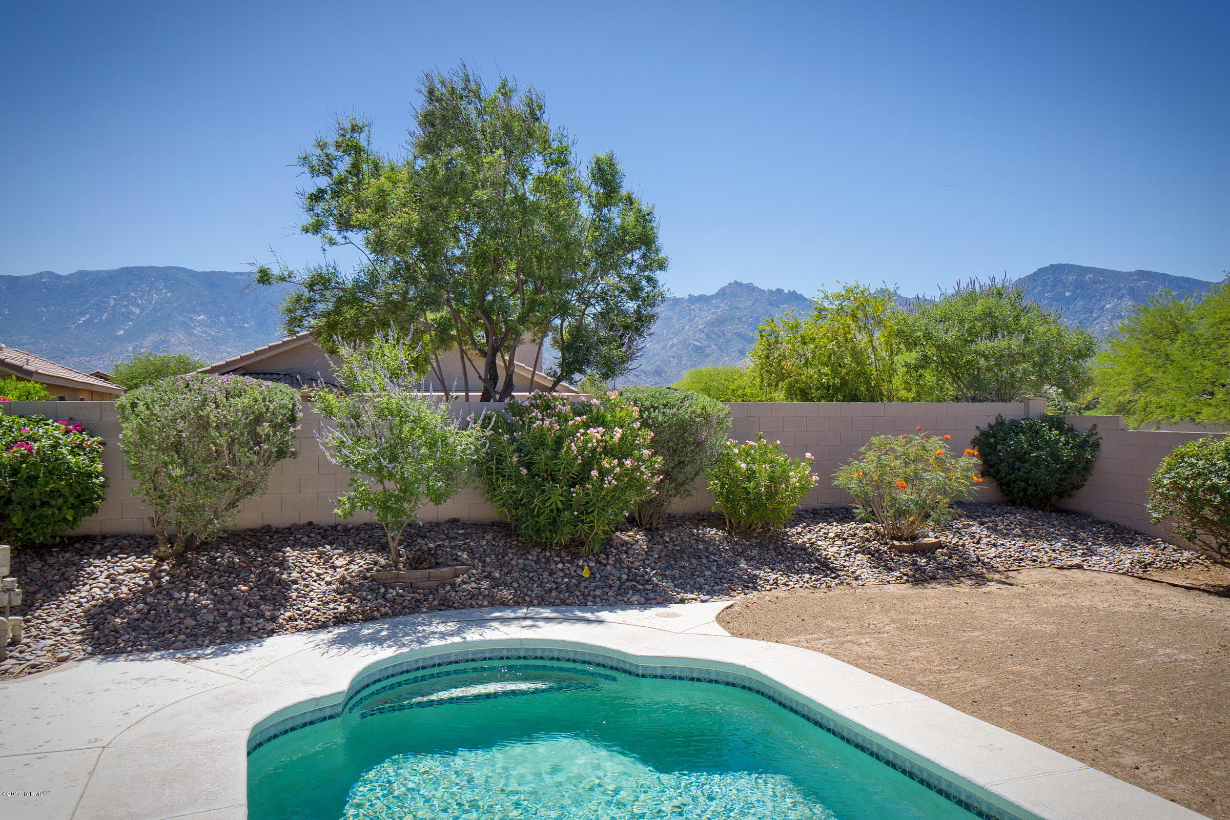 Incredible Find ! Move in ready - with BRAND NEW HVAC, BRAND NEW HOT WATER HEATER, NEW EXTERIOR AND INTERIOR PAINT, PRE-INSPECTED & REPAIRS MADE !!!!  Professionally cleaned - this home sparkles !  Great Mountain Views from backyard & private corner lot. Large covered back patio, nice sized backyard with pool.  Neutral interior colors with ceramic tile set on the diagonal, no carpet, ceiling fans, & all appliances included. Large living / dining with family room off kitchen. Utility room off garage.  Truly move in ready - you won't want to miss out on this one.  The owners went to great lengths to get this ready for YOU !