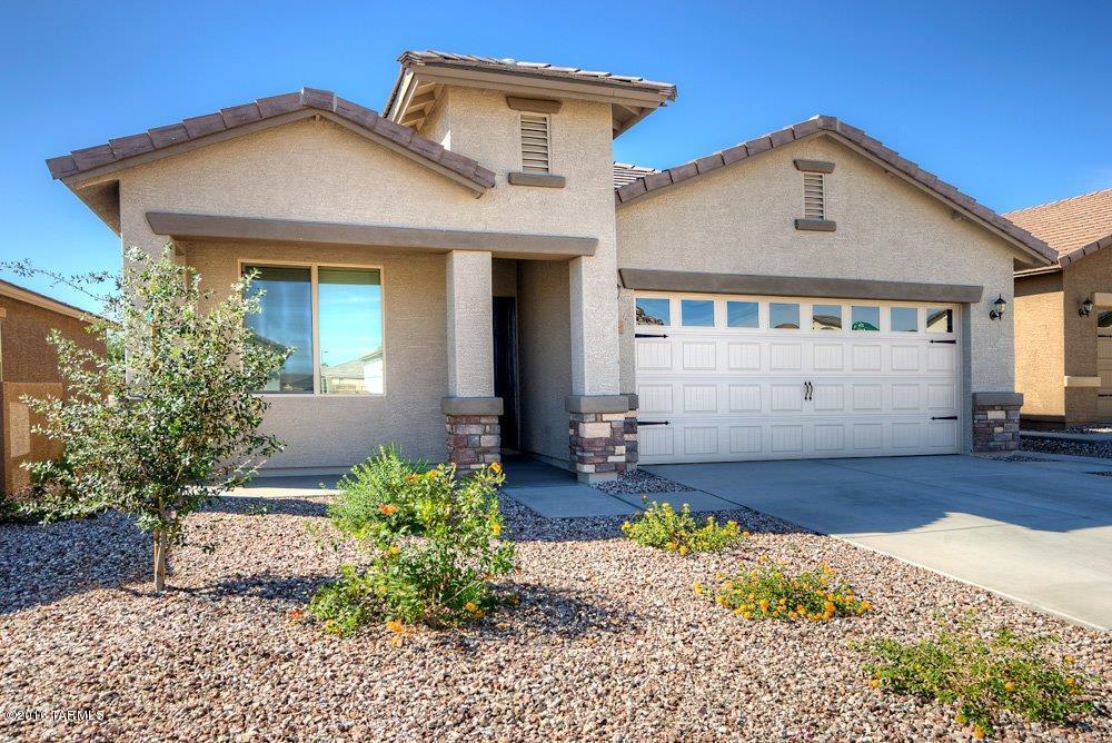 This beautiful new home comes with over $10,000 in upgrades including energy efficient stainless steel kitchen appliances, spacious granite countertops, custom wood cabinets, brushed nickel hardware and an attached two car garage. The Bisbee floor plan also showcases a master suite complete with a walk-in closet, as well as a separate dining room, a fully fenced backyard, covered patio and front yard landscaping. The San Lucas community offers a plethora of amenities including a community park, with basketball courts, sand volleyball courts and a baseball field. The amenity-rich community and new, hassle-free home provide an extraordinary lifestyle for you and your family.  Picture is of a similar home.