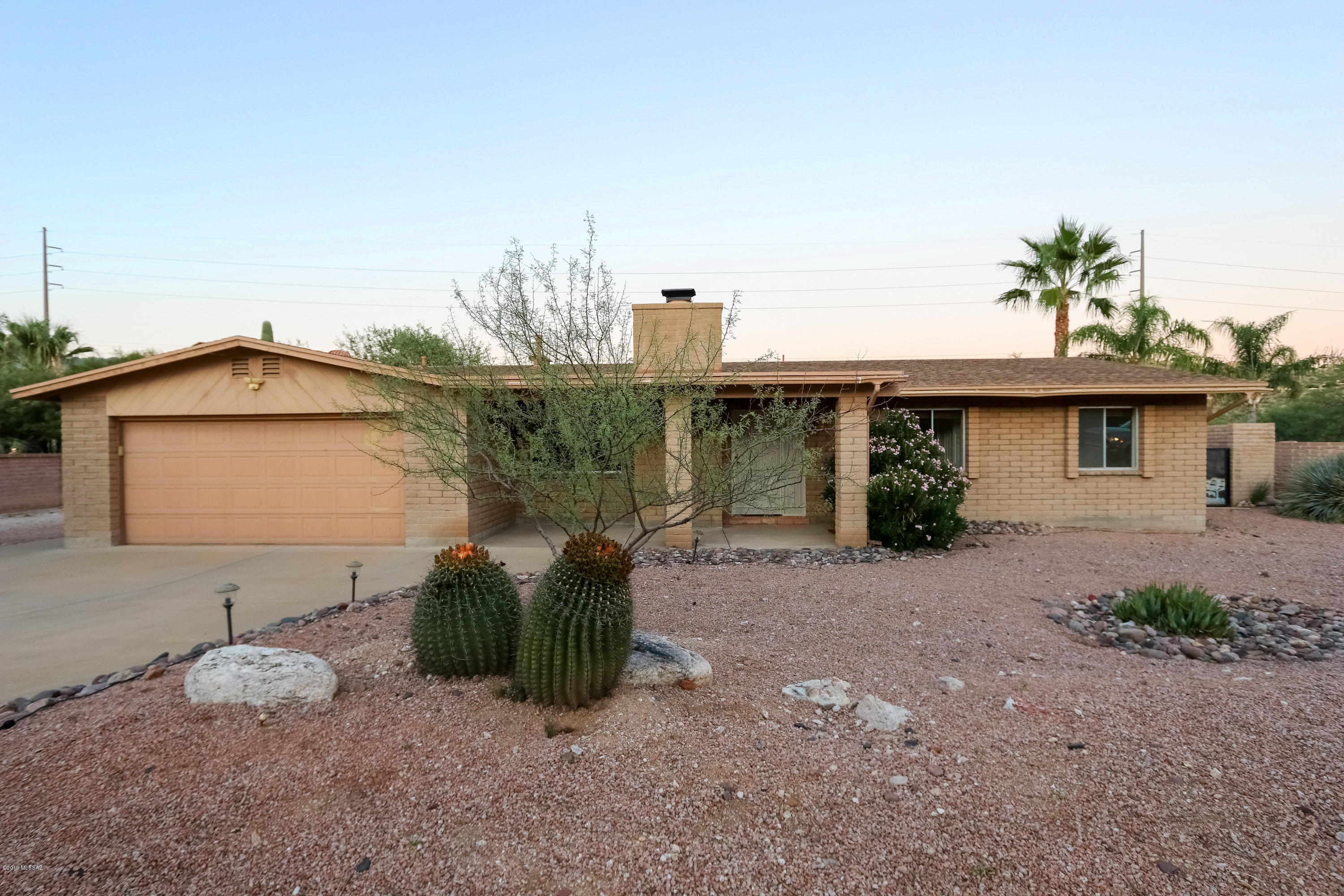 MOTIVATED SELLER! Stunning, Panoramic Mountain Views from this Move-in Ready Model Home in Quiet Quail Canyon Neighborhood. Large Lot Backs up to 30 Acre Natural Wash with Access to Walking Trails. Great Open Floor Plan with Beautiful Saltillo Tile, Wood Burning Fireplace and Ceiling Fans throughout. Kitchen Features Movable Island, Cabinets faced with Saguaro Ribs, Decorative Tile Counters and Fabulous Views! French Doors lead out to Large Covered Patio and Extended Cool Deck. Enjoy Million Dollar Views while Relaxing in Your Sparkling Pool with New Variable Speed Pump. New Interior Paint, Newer Water Heater and So Much More! This Home is a Must See!