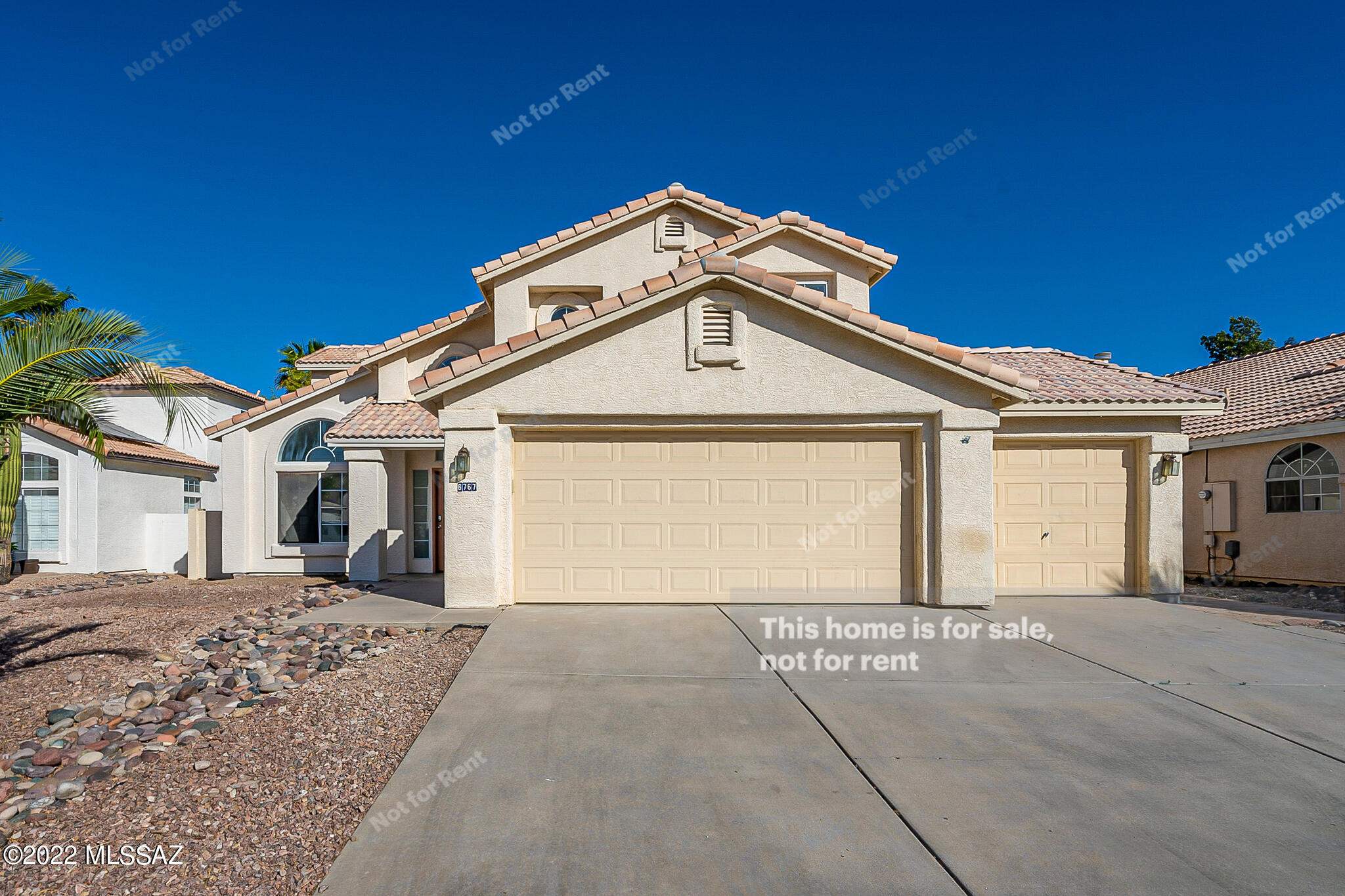 This Tucson two-story home offers a three-car garage. This home has been virtually staged to illustrate its potential.