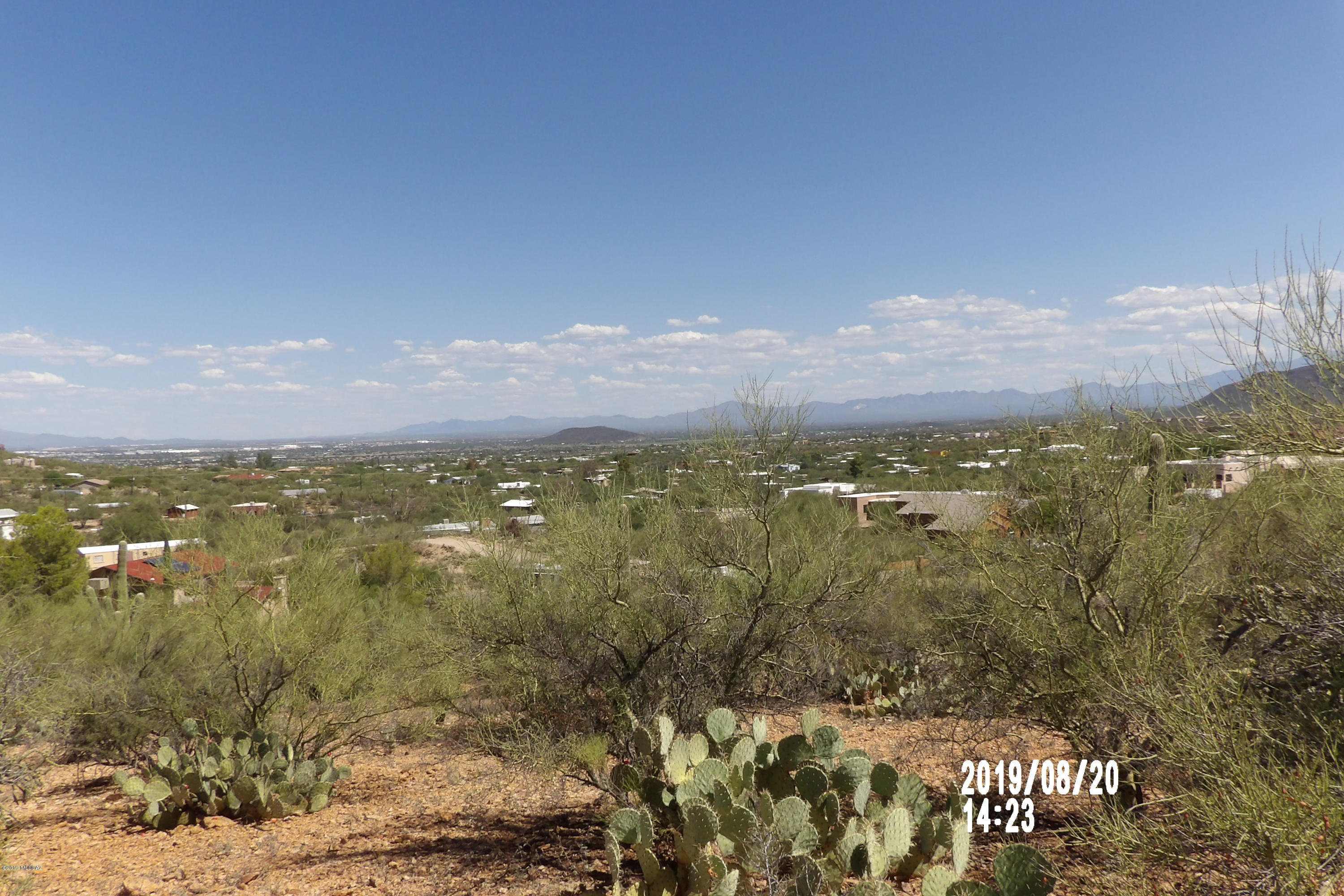 The views from atop this hillside lot are forever. Build your custom home here! Amazing views of the East and South east region of Tucson and Sahuarita from the top of this 1.71 acre lot. Mostly custom homes surrounding. Flat space at the peak allows for construction. Plenty of natural wildlife and vegetation. New home sales around $330K's. Don't miss out...