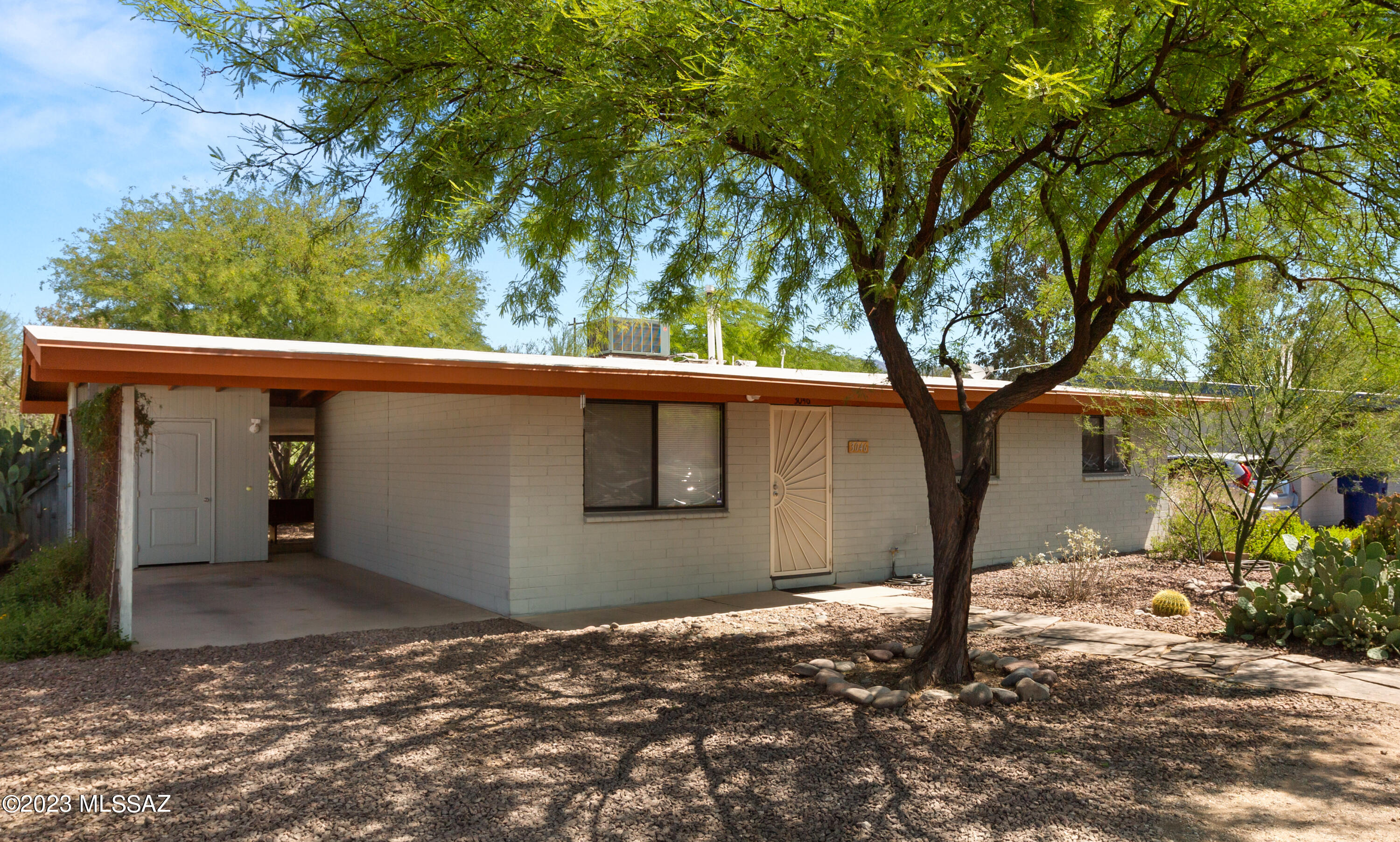 This charming 3BD/1.5BA block home  features stained concrete floors, stainless steel appliances, laundry room and a carport with storage. The 13 SEER HVAC is dated 4/15/2011 has been serviced 2x yr since install. New Roof dated 11/2/2017. New int & ext paint just done. Centrally located near shops, bus lines, University of Arizona, and convenient to Tucson Mall, and I-10. Located on a long cul-de-sac, it offers a big fenced yard, garden bed areas and a covered patio with plenty of space to relax, play, and make memories with your loved ones. Schedule your visit today and see for yourself why this home is the perfect fit for you!