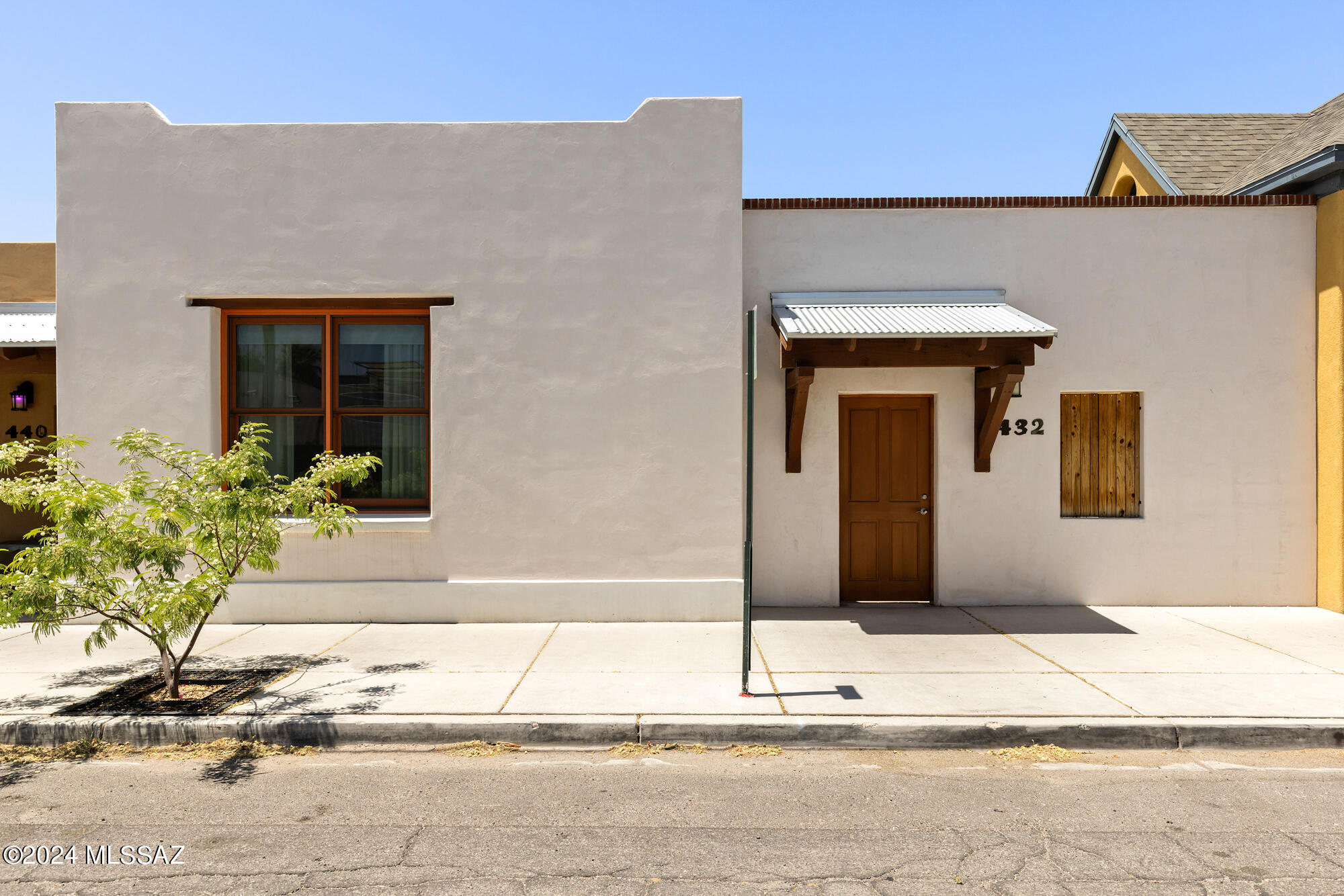 Located within the highly sought after community of historic Barrio Viejo nestled within the existing fabric of the downtown corridor, and within walking distance of all the area has to offer. This modern Sonoran rowhouse showcases a unique blend of contemporary design and traditional charm, offering a luxurious living experience. Enter through a private central courtyard, a pre a perfect retreat for relaxation or entertaining guests. The courtyard connects to the living dining and kitchen area as well as the ground level primary bedroom and bath. The central courtyard design not only enhances the flow and connectivity of the living spaces but also floods the home with natural light, complemented by tall, airy ceilings that create an open and inviting atmosphere. Spacious in layout, this home includes a one-car garage plus an additional parking permit, ensuring ample space for vehicles. Located just moments away from local eateries, cultural hotspots, and artistic venues, 432 S Meyer Ave promises a lifestyle of convenience and luxury.