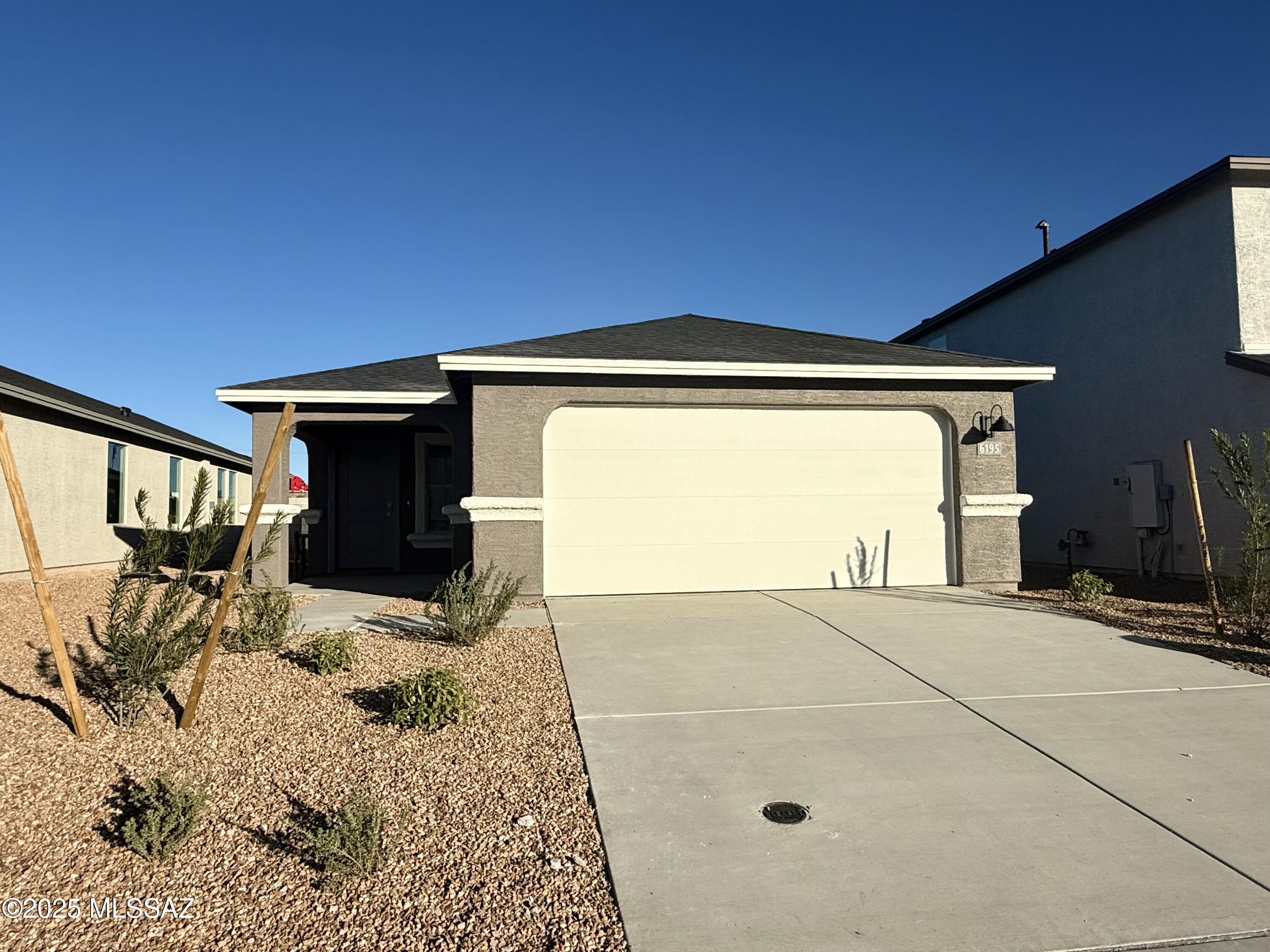 Home is under construction. Welcome to your ideal retreat in the heart of Tucson's newest community! This stunning single-story home offers 1331 sq ft of luxurious living space, featuring a spacious open concept floor plan that's perfect for modern living. With 3 beds and 2 baths, this home provides ample space for relaxation and entertaining. Enjoy the tranquility of a common area behind and a corner lot. Plus, rest assured knowing this home is ENERGY STAR Certified with a tankless water heater, ensuring energy efficiency and endless hot water. The inc smart home pkg adds convenience and connectivity to your daily life. With close access to I-10, the airport, and downtown Tucson, this home offers the perfect blend of comfort and convenience.