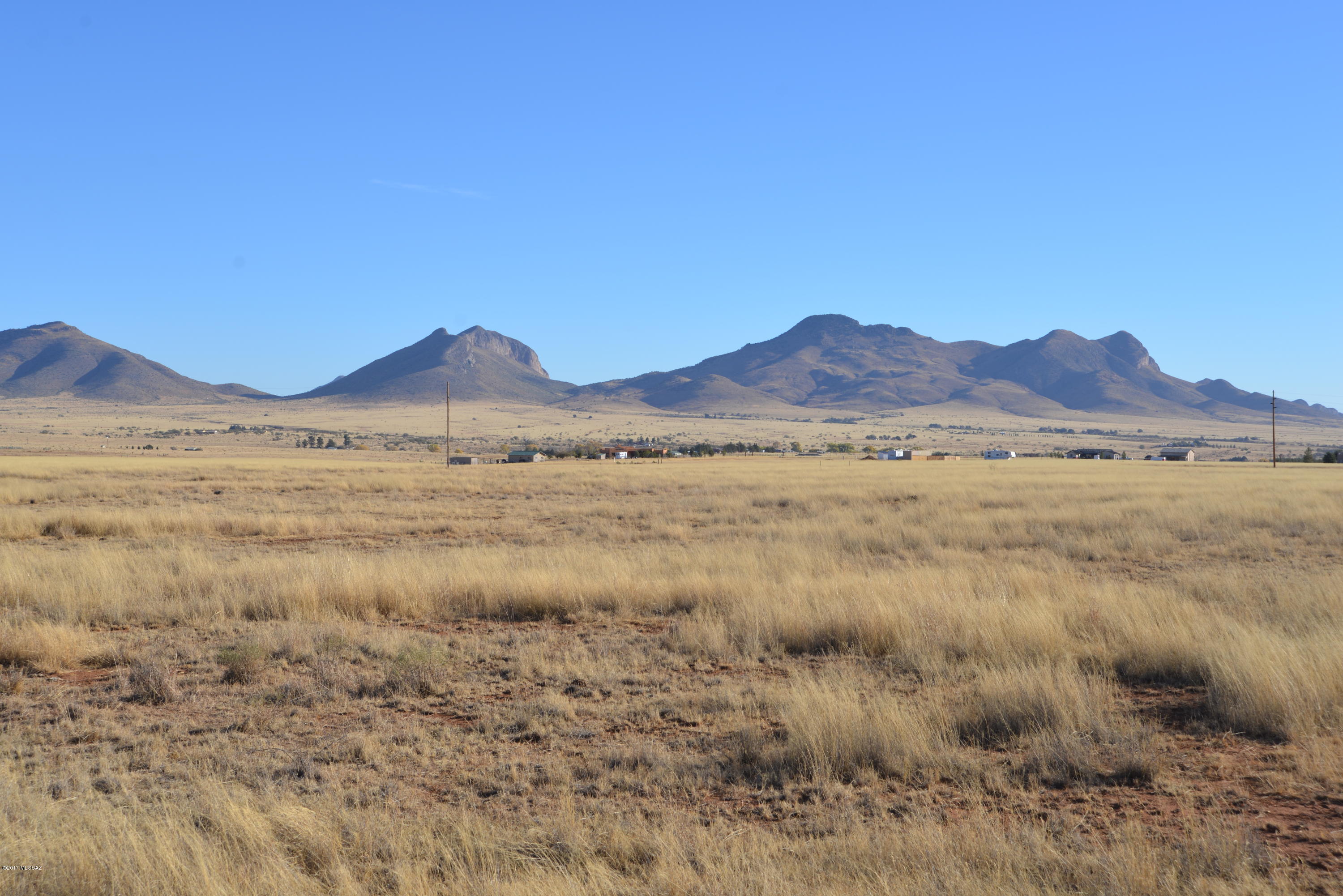 This is a very nice parcel of about 9.0 acres in Elgin, just south of Winery Row on quiet Camino Agave Road.  It is bordered by the Babocomari to the south and is fenced on the south line.  There is a good water table in the area, a conventional septic system should work, and there is power running down Camino Agave.  Parcel B, the other proposed parcel directly to the west, is also available for a combined 18 acres.  With excellent views in all directions this will make a lovely homesite.