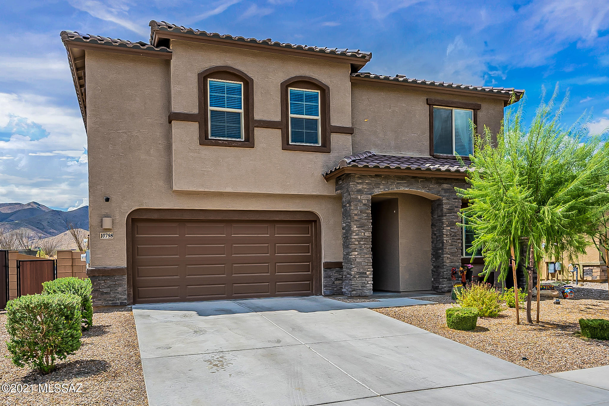 Gorgeous Lennar home with room for the whole family and views for days! 4 large bedrooms, 4 bathrooms, with One bedroom & bath downstairs! Extended loft upstairs with option for easy conversion of 5th bedroom. OWNED solar! Gorgeous heated pool with spa that seller's JUST BUILT including landscaped yard with Turf & raised garden bed!  3 car tandem garage is perfect for those large cars and extended trucks(they fit inside!), or have a workshop space here. Beautiful kitchen that overlooks living area with soaring ceilings that make a dramatic effect upon entry. Water softener, filtered water, large island, gas range- it has it all!  Backs to Buffer area with Mtn views! Smart home is prewired for all your needs. Large master suite has private balcony facing right towards those beautiful views!