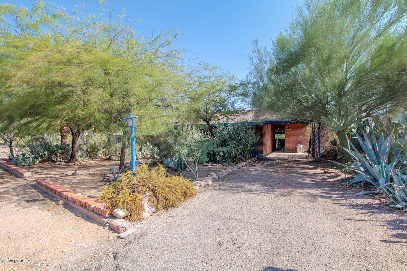 Meticulously maintained and Move-In Ready Home in the Desirable Sam Hughes Neighborhood! This historic home boasts natural light, dual-pane windows throughout, tiled & laminate wood flooring, recessed lighting, a large backyard and a ton of charm! Laundry room off carport. Newer water heater and AC. Located in the heart of Tucson! Minutes away from UofA, Banner Medical, Downtown Tucson, Randolph Golf Course, Reid Park Zoo and more. The spacious front and back yards are a Sonoran Desert lover's dream, with a plethora of native plants and cacti as well as many species of wildlife, including quail, roadrunners, lizards and desert squirrels who frequently visit the property.