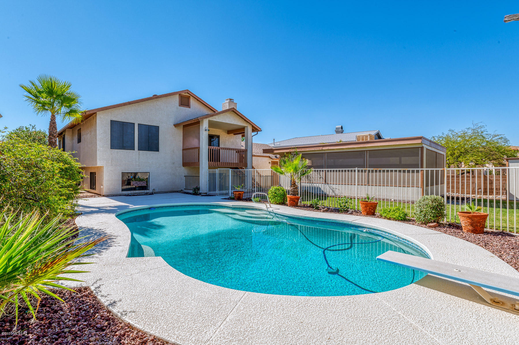 Rare 5 Bedroom on Huge lot and features a Beautiful Pebble Tec pool! Updated &  Move in Ready! Entire Interior home has been professionally painted. Real wood floors have been professionally restored. Brand new carpet in all bedrooms. Brand New Designer floor tile and New Corian Counters in kitchen. Baths all updated & HUGE laundry room. Dining overlooks pool & backyard. Brand new wood vinyl flooring thru out first level. *Bonus-massive downstairs living space that could be used as guest suite includes 2 bedrooms and full bath with separate entrance. Step outside to your fully landscaped entertainment backyard. Stunning Pebble Tec pool w extensive cool deck for tons of space to entertain or family fun. Huge enclosed patio w spa & cooling is also included in this Amazing backyard.