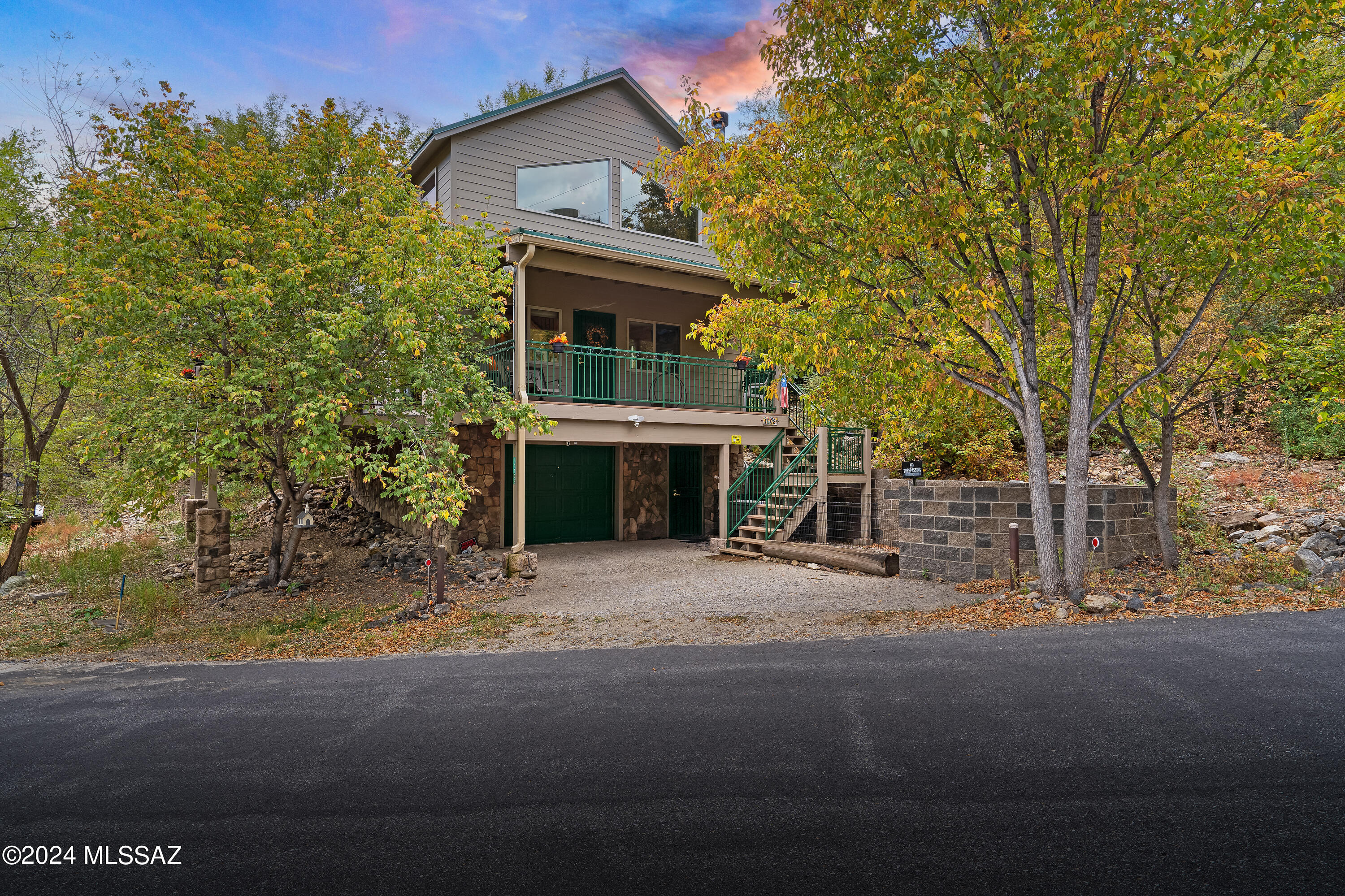 Just a short drive through the aspen and pine trees lies this Year Round Retreat on a double lot in Stunning Summerhaven.

Escape to this delightful cabin nestled in the serene beauty of Mt. Lemmon! Just a short walk to the Cookie Cabin or for Lunch at the Mt. Lemmon Lodge. This 3-bedroom, 2-bath (plus Loft) home features indoor and outdoor spaces perfect for hosting guests or family.

Step inside to find a beautifully designed kitchen and bathrooms, boasting elegant granite countertops and stylish bamboo floors and tile. Two full bathrooms are pristine with granite countertops and tile shower surrounds. Cozy up by the wood-burning fireplace on chilly evenings or enjoy the fresh mountain air on one of the two spacious patios. High end finishes, meticulous care, and a a large garage/storage area make this a spectacular getaway in one of Arizona's most beloved destinations.