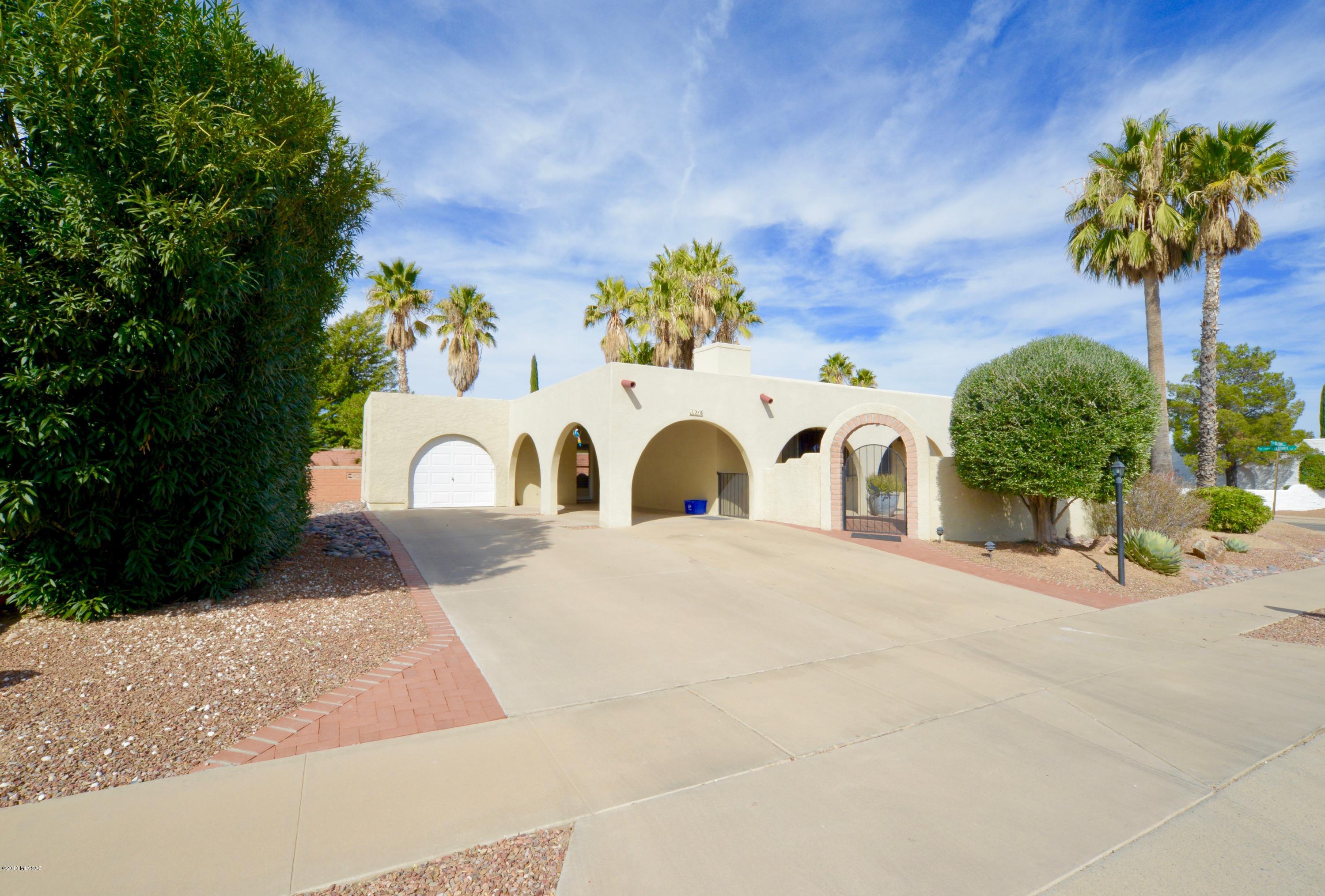 Delightful home in beautiful Country Club Vistas 1. Situated on large corner lot completely fenced for total privacy.
Enclosed front courtyard with mountain top view. Enter through very nice security door and lovely lead glass entry door. Very nice southwest paint and desirable gas log fire place greets you in the living room. 2bd 2 bth with nice AZ room. AZ room not included in square footage. AZ room can remain furnished with hide-a-bed sofa and electric fireplace at no cost along with full size sofa in living room. Picturesque large completely fenced yard with 2 bricked patio areas. Perfect area for your furry children. Enough paved parking for 4 cars. NEW HVAC, DEC. 2016 AND HOT WATER HEATER 2017. DON'T MISS THIS ONE!