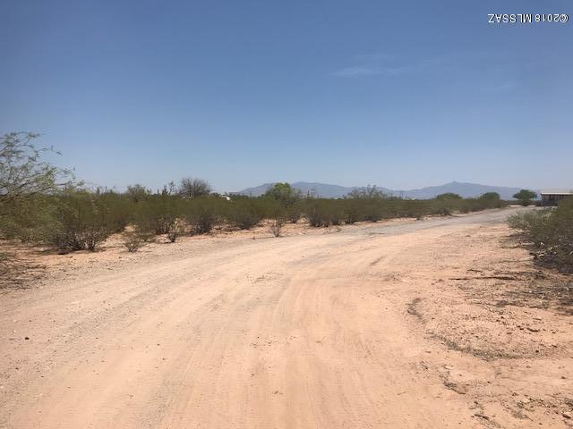 Prime piece of land located on the South Side with all utilities and cleared terrain.  Mountain views, shared well, partial fenced on over 4 acres!