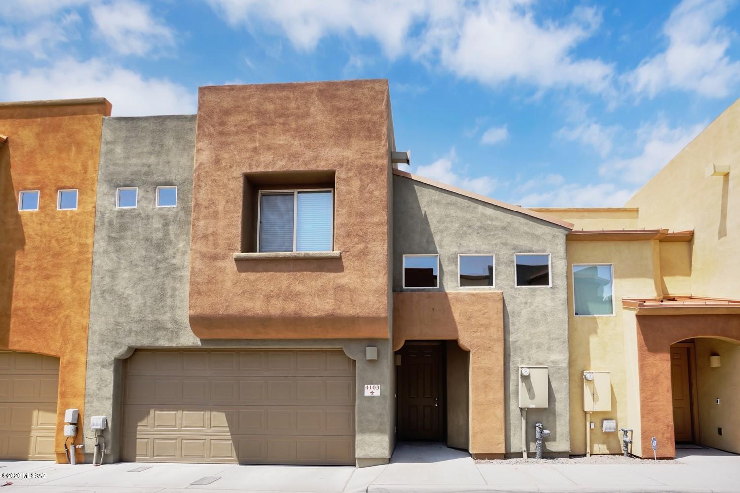 Central location - Two-story-3br/2.5ba Townhome in gated community! Rustic iron gated entry, upgraded maple cabinets, granite countertops, and upgraded appliances including microwave in Kitchen. Walk in pantry, w/d in closet. Half bath downstairs, dual sinks in Master bath, dual pane Low E windows. Finished 2-car garage, Covered patio, cozy backyard, just 3 miles from UA on bike path, and TUSD Schools (5th Ave/ Alvernon)