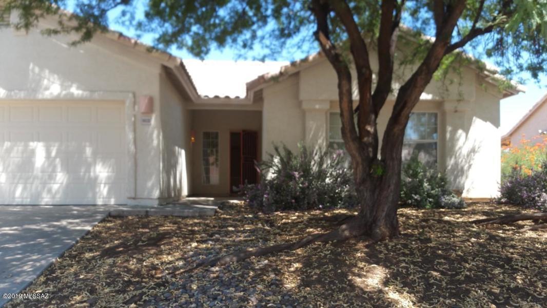 Great Rita Ranch home, 3 bedrooms, 2 baths, Great Room design!  Laminate floors in all living spaces throughout, except in bedrooms and baths. Fantastic open kitchen, with island, and nice pantry. Soaring ceilings in great room, and lots of light. Bedrooms and great room all have
ceiling fans to help reduce those electric bills! Huge lot, with great backyard for entertaining. Covered patio, and separate storage shed, completely finished
inside. Call to see this great family home, before it's too late!!