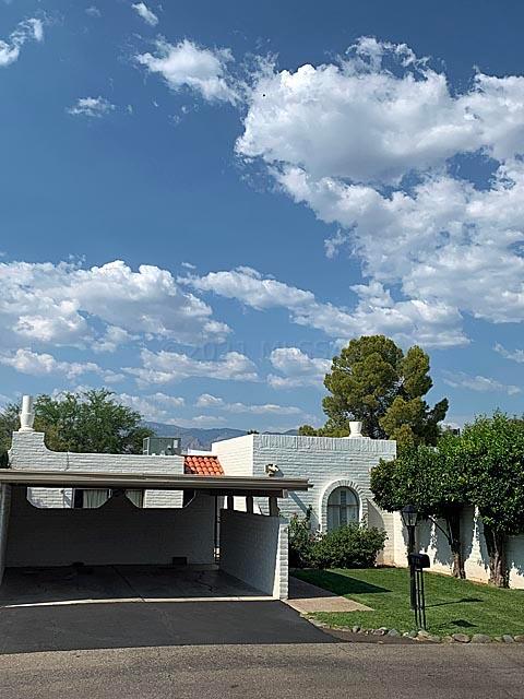 This updated 2/2 townhouse in the popular TIERRA DE VIDA subdivision has outstanding views of the Santa Catalina Mountains from the spacious covered patio. Neutral ceramic tile and engineered wood throughout. NO CARPETING. Gas fireplace in living room. Spacious storage room off covered patio plus an even larger detached storage shed in backyard. Mature purple vitex (aka chaste) tree is about to burst into aromatic bloom. New (2021) double-pane sliding glass doors North side. Located ~50 yards from community pool and rec area, and ~1 mile from Udall Park and the brand new outdoor Udall Pickleball Complex. Great neighborhood and wonderful neighbors. Live and in-person OPEN HOUSE on Sunday, June 20 from 1:00 to 4:00 PM. DEADLINE: Seller to review any and all offers on Monday, June 21 at noon