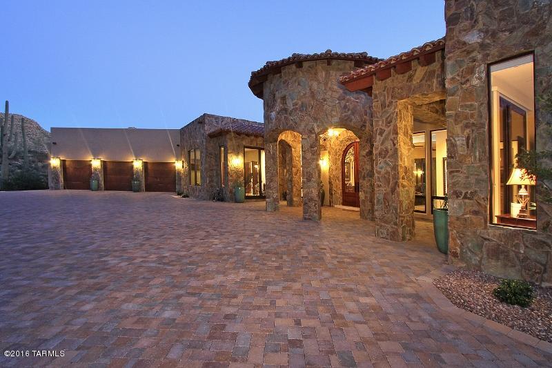 Uncompromising VIEWS-LUXURY-PRIVACY are afforded by this 4BR/6BA Tuscan Masterpiece completed in 2015. Set high within the picturesque, guard gated community of 
Canyon Pass at Dove Mountain, an inviting stone facade and cupola turret entry welcome you. Striking 5,826 SF interior boasts dual Master Suites, Guest Bedroom, Exercise Rm/Office/4th Bdrm, Wine Room, 13'-15' backlit coffer ceilings, crown molding,  baseboards, smooth Travertine tile, Granite-Marble-Onyx countertops, and Cherry Wood  cabinetry. State-of-the-art Kitchen boasts side-by-side Sub-Zero refrigerators & Wolf appliances. Added 2,250 SF of covered porches, 9,000 SF of pavers, 3 car garage, 3 fireplaces, 5 electronic sunshades, 4 HVAC zones, Surround Sound, Saltwater Pool/Spa, Summer Kitchen and  
Top-of-the-World Views!