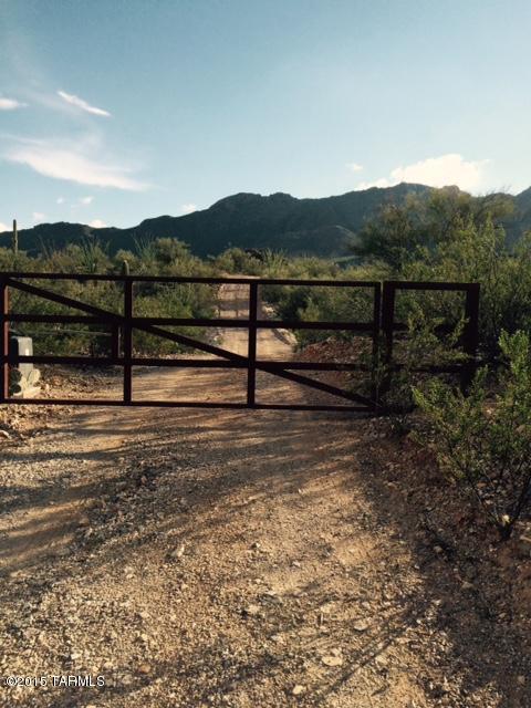 Sweetwater Canyon! One of the last great parcels remaining! 5+ Acres backing up to Saguaro National Monument. Deed restricted for preservation. Tucson Mtns. in your back yard; city lights below! A desert sanctuary to come home to! Hear the Coyotes howl & watch the saguaros bloom.