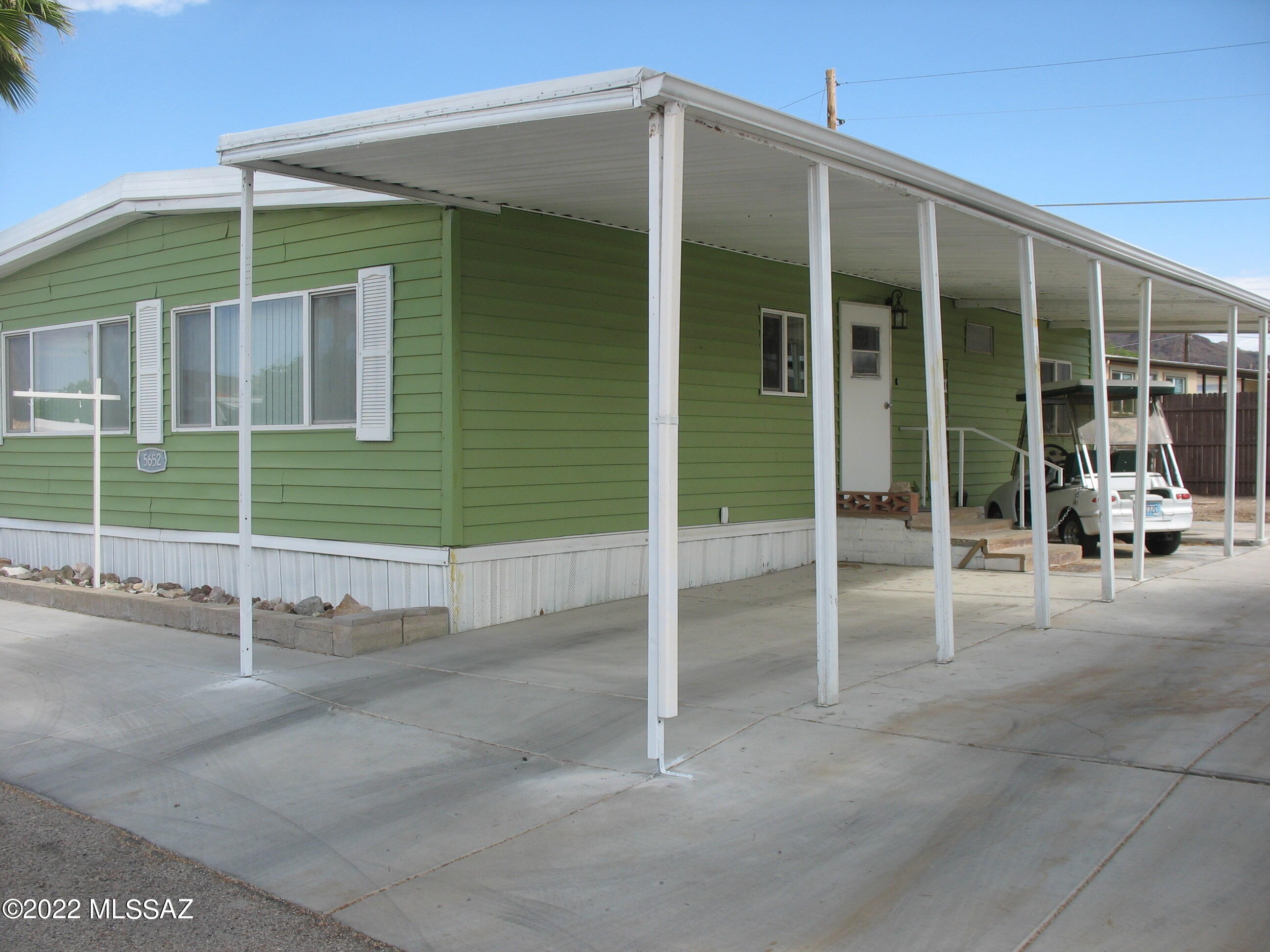 Recently updated 2/2 in the desired +55 Active Adult Community of Tucson Estates. New high tech fridge with  ice maker line, RO water under kitchen sink, newer front load LG Washer and dryer. House has been releveled with 12 new base support stands installed.  New cement recently added. Fenced, spacious back yard has plenty of room to add an patio entertaining area.  New TOUGH SHED workshop installed with insulation and drywall, ELECTRIC, TV AND AC unit! Recently purchased furniture and GOLF CART INCLUDED WITH PURCHASE.
