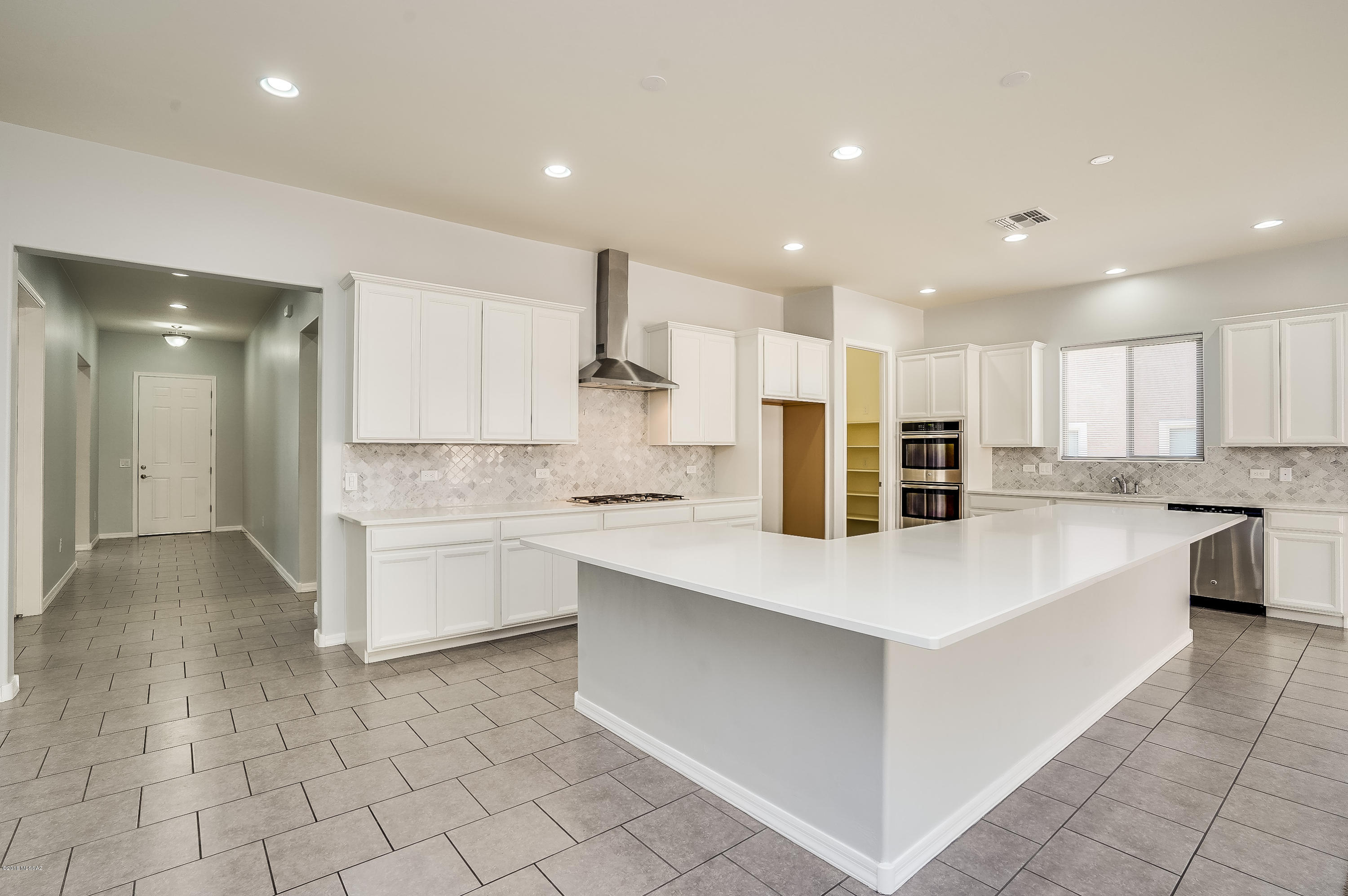 This lovely Timothy model welcomes you with soaring 10' ceilings and all the bells and whistles. Many upgrades that you will absolutely love. Gourmet kitchen with quartz counter tops, stone back splash, double ovens, pantry, 5 burner gas stove top, enormous walk in pantry, and huge island with room for the entire family. A wonderful kitchen for the person who loves to cook and enough room to share the cooking duties. Enjoy the large great room with fireplace and wonderful area for entertaining. The 4th bedroom has a standing closet. Private backyard with no neighbors behind. Great play area nearby. This home is a must see!