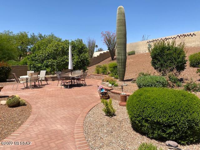 This popular Topaz Model is located in the desirable active adult community of Saddlebrooke with all of its golf courses, club houses and amenities. Kitchen comes with granite counters, stainless appliances, pantry and large counter areas. Sunny Breakfast Nook with Bay Window and work area. Family Room is open to Kitchen with Vaulted Ceilings & separate work area. The Living/Dining Room is perfect for entertaining. Spacious Master Suite comes with a Walk-in Closet and Dual Vanity Sinks. Comfortable Guest Room & Full Guest Bath. Oversized Laundry Room with Cabinets. Large Private Outdoor Living Space with Covered Patio and extended pavers leading to 2nd patio. Plenty of Room for a Pool or Spa if desired. Extended Garage has built-in Cabinets. This home is priced to sell and won't last long!