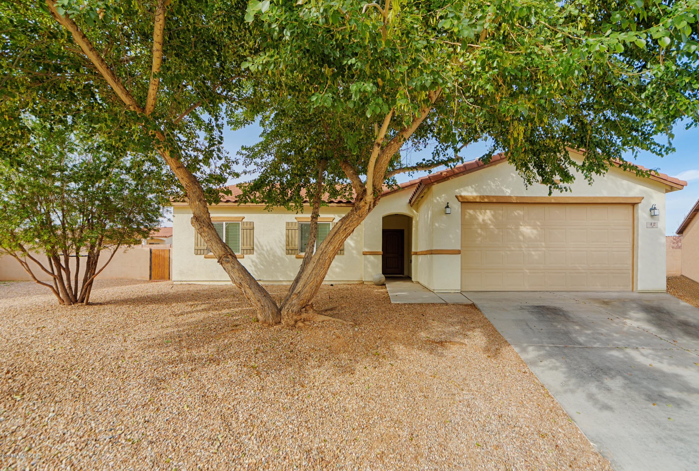 Close the main club house and pool! Three bedrooms, two baths. Open concept kitchen, dining & great room. All kitchen appliances remain. Backyard is HUGE! Ready for pool, outdoor kitchen, kids play area or whatever you want. Room for it all! All neutral colors. Interior and carpets commercially cleaned. Short distance to shopping and schools. Enjoy the Rancho Sahuarita life style!