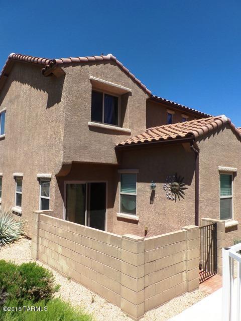 Charming 2 Story Energy Efficient Home in Sierra Morado!! This home is located on a corner lot with stunning desert views! Located in the Vail School District!! Community amenities include parks, walking trails, basketball courts, and community swimming pool! Neutral paint tones throughout entire home! An inviting kitchen comes complete with two elegant chandeliers hung above the kitchen island. Includes all kitchen appliances, TONS of cabinet space, pull out cabinet drawers and a HUGE pantry! An extra room off of the living area can be used as a den/office. Custom wall tile in downstairs guest bathroom! 2 car garage! Gated outside patio perfect for entertaining with friends or family! Please call to schedule a viewing at this alluring home!
