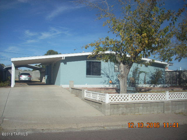 This home is beautiful. Built-up front yard with concrete driveway, and 2 carports, 3 sheds and block wall. Inside has been completely remodeled with wood flooring, cheery paint colors, cottage kitchen, new bathroom, added laundry/storage room and large patio. Must see!
