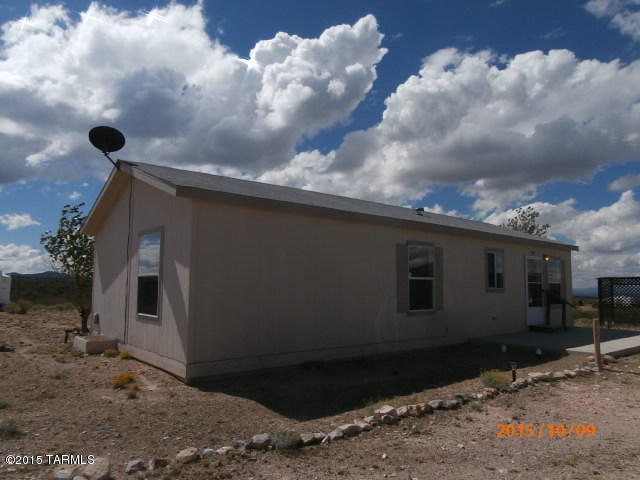 Small clean doublewide on 5 acres with large barn and shop being sold ''With Repair''.  This property has State land on two sides.