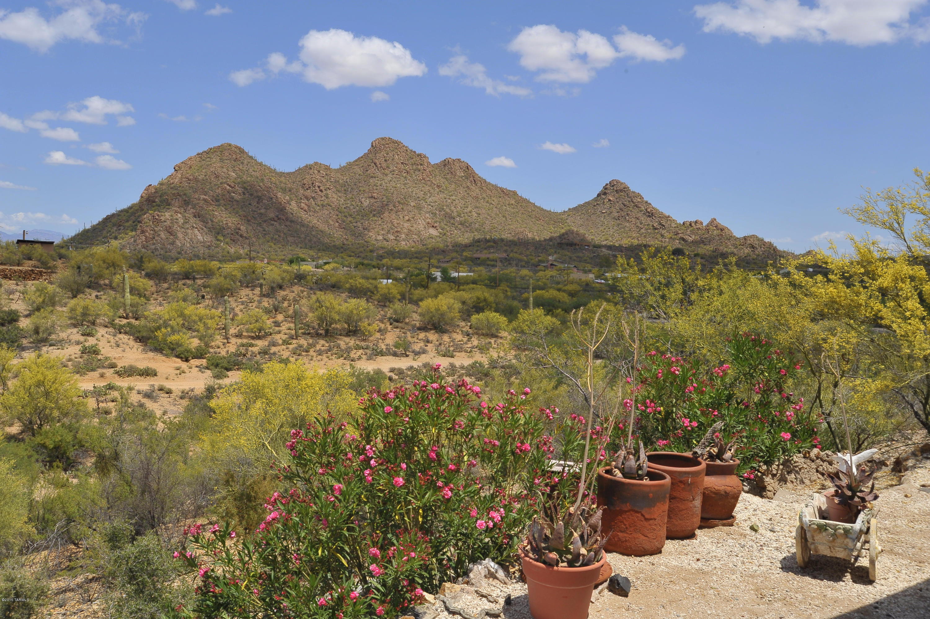Peaceful and Pristine desert living in this hilltop Hacienda. Jump on this opportunity to own 5 acres in Southwest Tucson. Wonderful 3 bedroom, 2 bath home w/ breathtaking  views from every window making this home a joy to behold. You will love the cozy seating area with fireplace off the master bedroom suite on those chilly winter nights! This home is a definite must see!