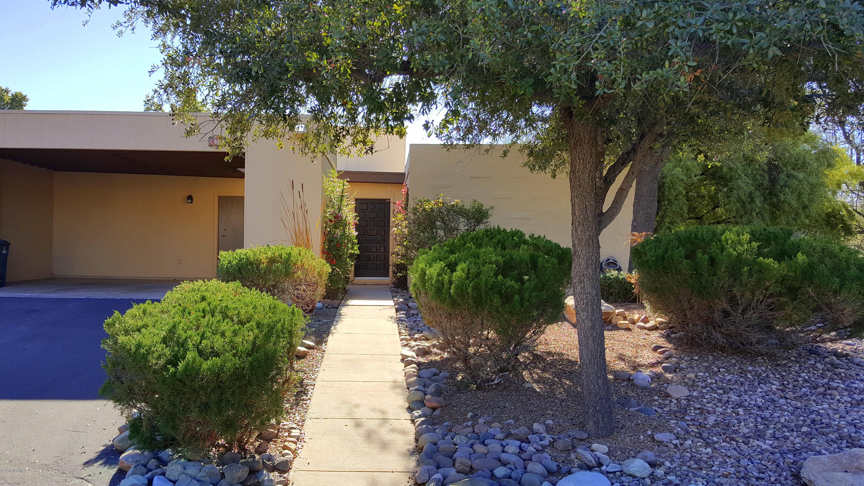 FULLY FURNISHED! Fantastic Townhome in small private enclave!  This home is located in a wonderful little hidden community right next to Udall park.  Close to shopping, dining, banking, biking, hiking, you name it.  This is an end unit backing up to a large common area giving this home a large open feel.  This is a 2 bedroom 2 bath home with a kitchen / breakfast room with newer appliances, a large open dining room and family room with 'bee-hive' fireplace and a wonderful covered back yard patio. Furnishings available on a separate bill of sale. Turnkey opportunity for  winter visitors, rental property, or...