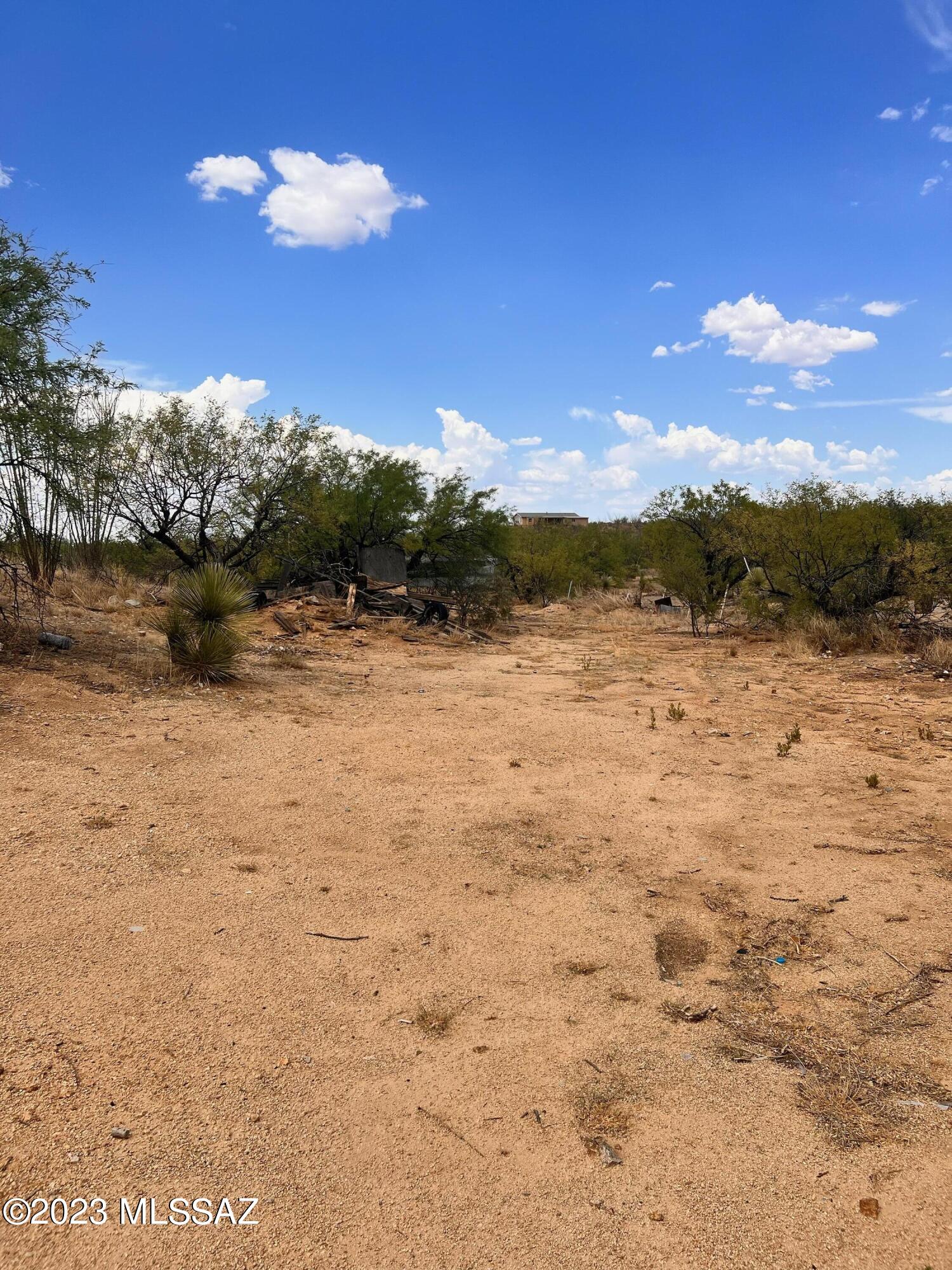 4.94 Acres of land ready for you to develop. Horses and manufactured homes allowed.  Has a non livable mobile home on property. Property is sold as is.