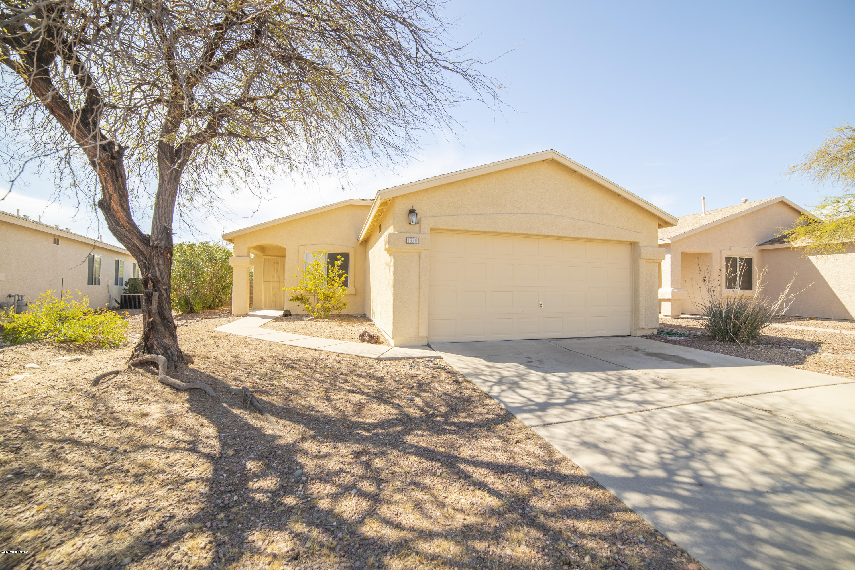Range pricing. Seller to accept or counter offers between $185,000 and $189,900. Fantastic 3 bedroom, 2 bathroom home in desirable neighborhood. Located close to Saguaro National Park East, shopping, and dining. Featuring a great floorplan, updated kitchen with modern hood-fan, wood laminate throughout the living areas and bedrooms, and new wood-look tile in the kitchen and baths. Brand new roof in 2018! This is a must-see!