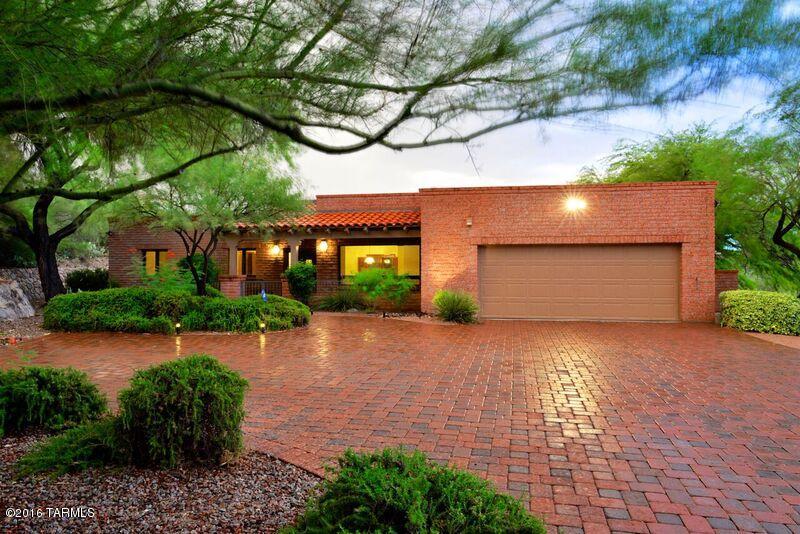Handsome home built by Andy Arena delightfully updated with plantation shutters, block paved driveway and newer appliances.  Pella windows, high ceilings, french doors.  Awesome curb appeal and split floor plan.  Beautiful mountain views and lovely city lights from the pool.  Full length patio, bbq area w/FireMagic gas grill and sparkling pool with newer Zodiac cleaner.  Enjoyable back yard is very private & incl. mature plants plus fruit trees.  Kitchen with lots of bar stool seating open to family room with bay nook.  Perfect area for morning coffee or game table.  Tons of cabinets/storage. Gas f.p., beam ceilings, big picture windows for lots of natural light.  Shows very well!