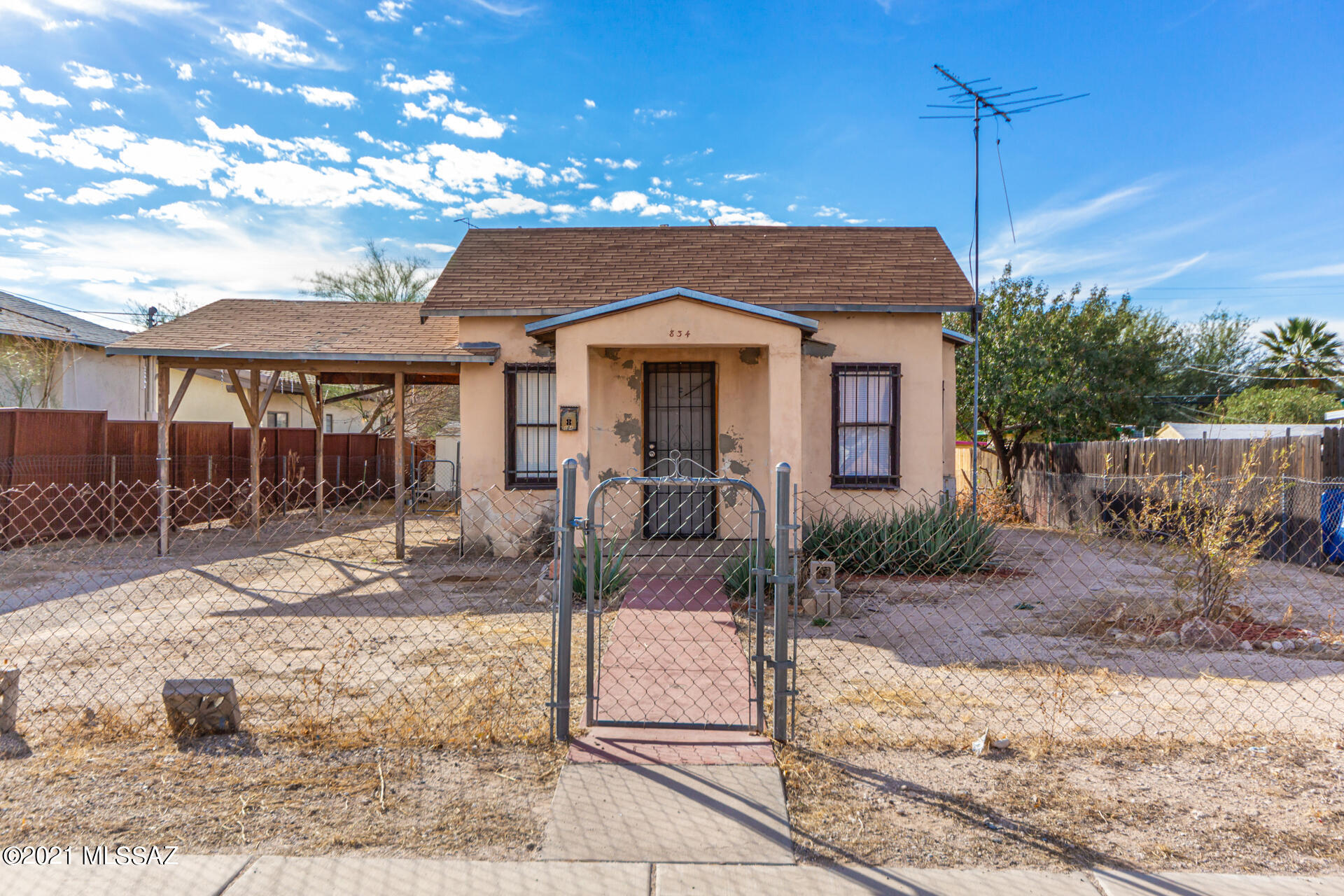 GREAT LOCATION within walking distance to UofA and Banner Hospital. Main house is 2BD 2BA 872 Sqft, built in 1938. Newer stove, refrigerator & window AC units, updated electrical, tile thru out, wall heater, 2 parking (1 covered) spaces + street parking. Duplex in back is 1BD 1BA, approx. 500 Sqft each built in 1948, updated 8-10 years ago. 1 unit has evap cooling, other unit is wall AC.  Both have tiled showers. 4 parking spaces in alley right behind duplex.  Great rental history for all units.  
Property is sold AS IS.