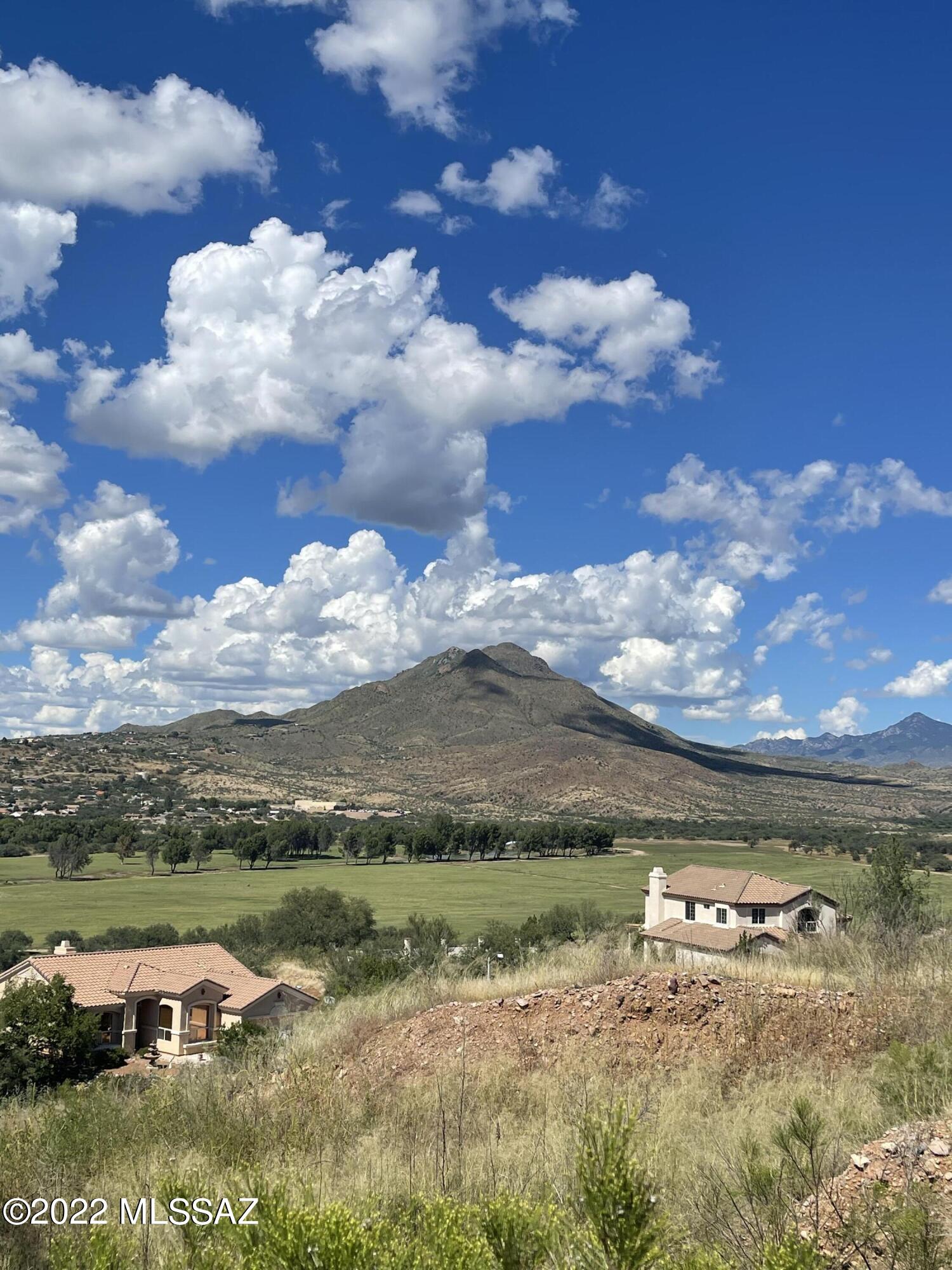 Build your dream home on this 1.09-acre lot with breathtaking views of the nearby mountains. North/south exposure and paved roads. Centrally located in Rio Rico with easy access to the freeway.  Five minutes away from the Rio Rico Fitness Center, Rio Rico Community Center, and walking trails.  At 3500 elevation, the average temperatures are 10-15 degrees cooler than Tucson.  Fresh mountain air, blue skies, cool breezes and an abundance of wildlife in a rural atmosphere make it truly a hidden gem!   Electricity pole and water are nearby. The septic system has already been installed on this property.  Submit all offers!