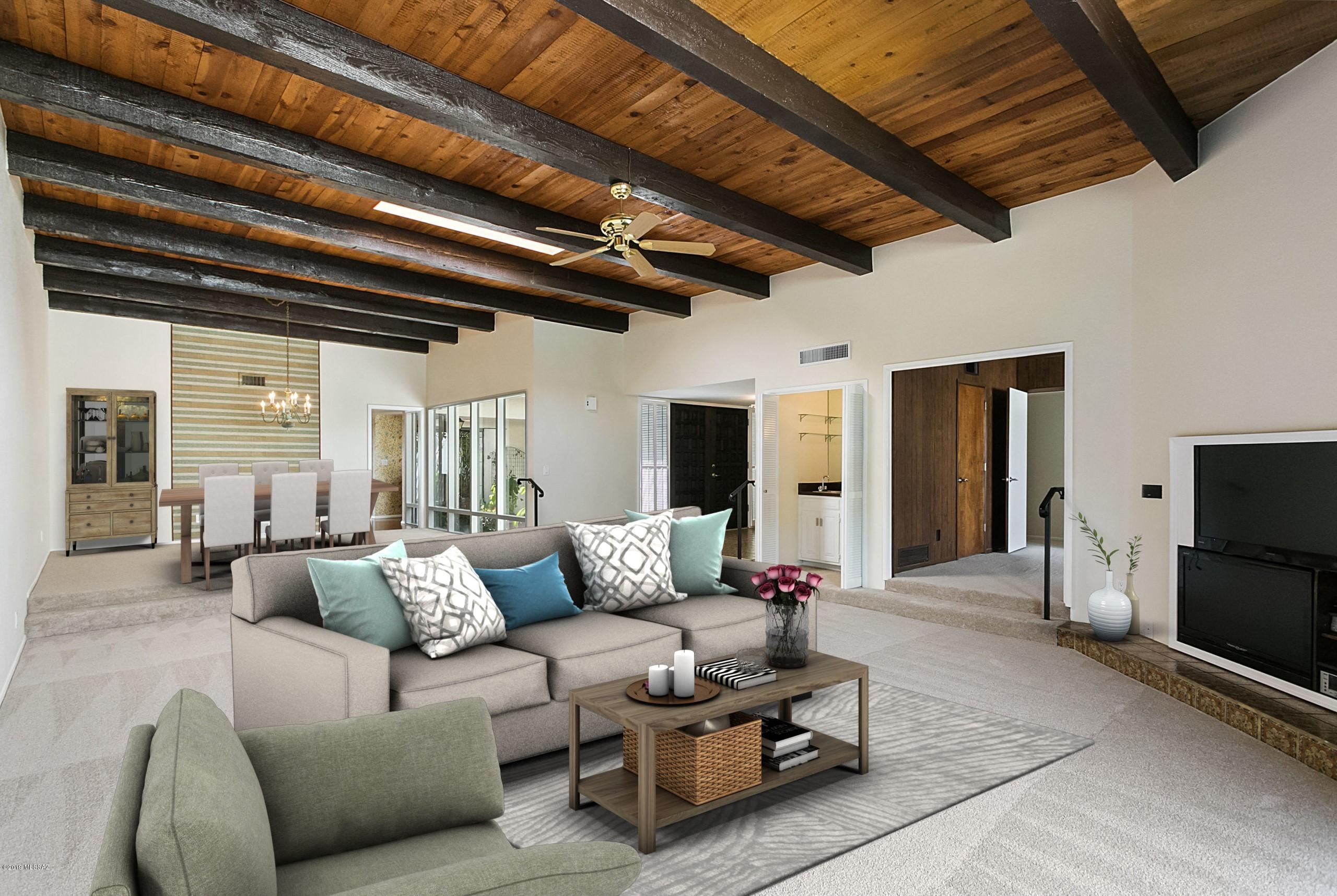 Looking for 14'' ceilings? This is the only one of its kind at Westward Look! Stunning home filled with light, huge oversized windows, soaring 14 ft beamed ceilings and enormous character! The original Show Home & one of the only single story homes there. 3 large bedrooms open to lovely serene patios. 2316 SF- all rooms are large w/ lots of storage – making it the perfect home to choose for downsizing. Beautiful spacious courtyard, landscaped front and back patios, 2-car garage w new epoxy floor. Updated w new paint, carpet, door hardware, bath fixtures, light fixtures & roof coating This unique town home is just steps from the completely renovated pool, open space & guest parking. Small community, peacefully tucked past the resort with great stores and shopping less than ½ mi away.