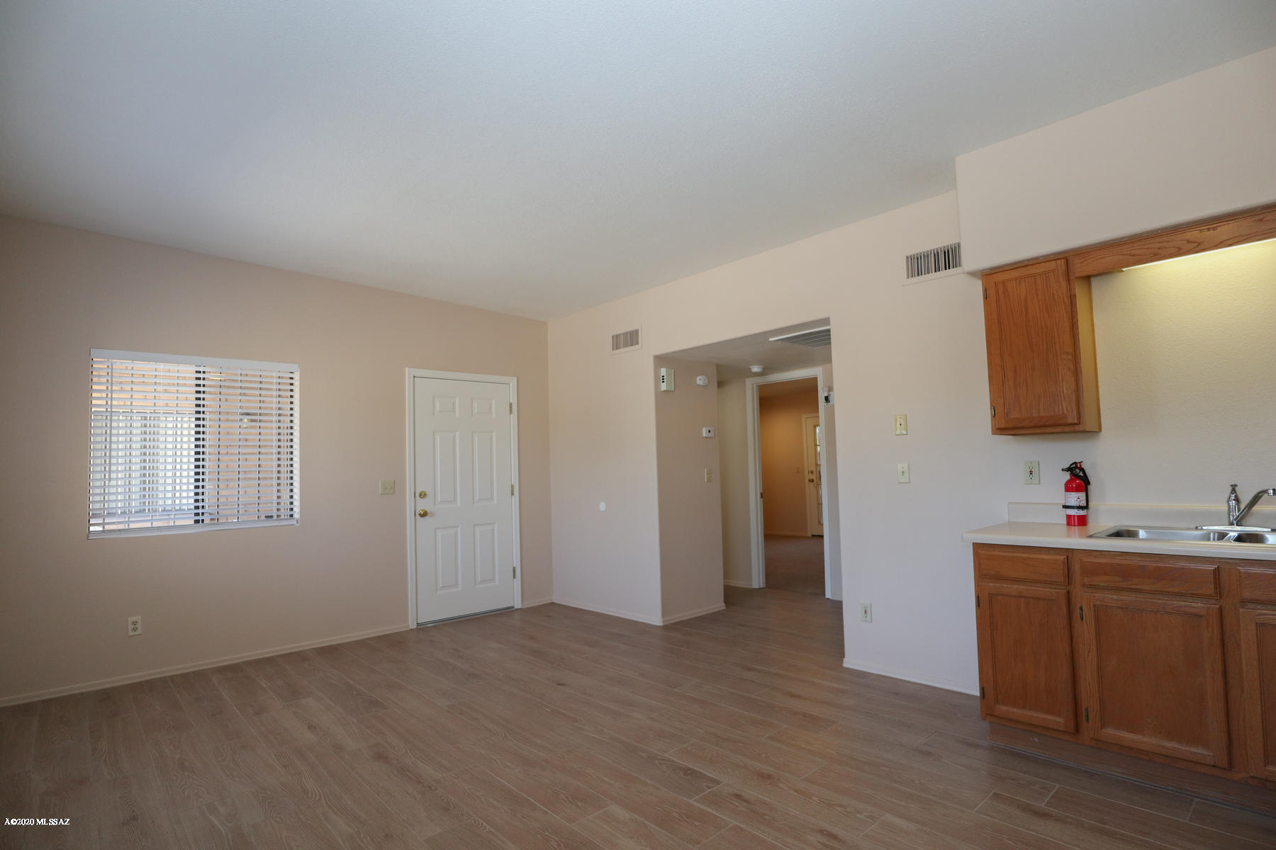 Great location, historic old Tucson neighborhood close to UofA!  The Owners have lovingly remodeled this property with fresh paint and new appliances, and you'll love the new window coverings, easy-care plank flooring and carpet.  This 2-bedroom, 2 full bath townhome has a greatroom floorplan with huge kitchen/dining area, desk nook in each bedroom, electric washer/dryer hook-ups, central air and ceiling fans throughout, large fenced back yard, bike lock-up area on front patio and 1 covered parking spot with storage.  Close to everything you need.  This isn't just a crash pad, it's a real home with nice neighbors.  Assistive animals only plz.  Ask for P#3253-Q.