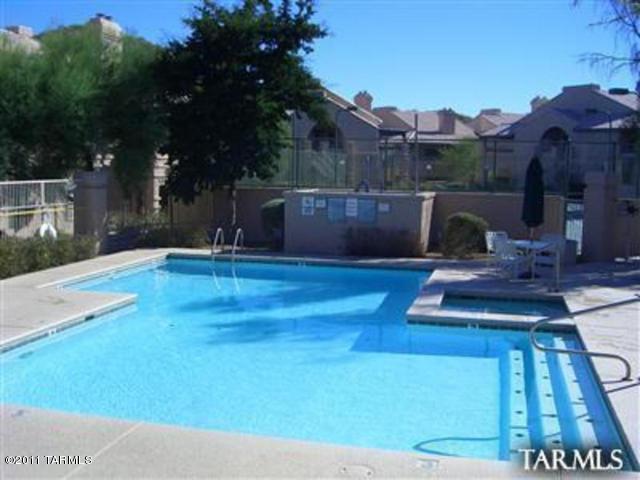 Beautiful ground floor Condo in Moonrise at Starr Pass. This Condo is open and bright with granite counter tops and fireplace in the living room. Enjoy the Clubhouse, Community pool and Exercise facilities. This Condo is close to Pima West, the U of A and easy access to I/10. Call today!