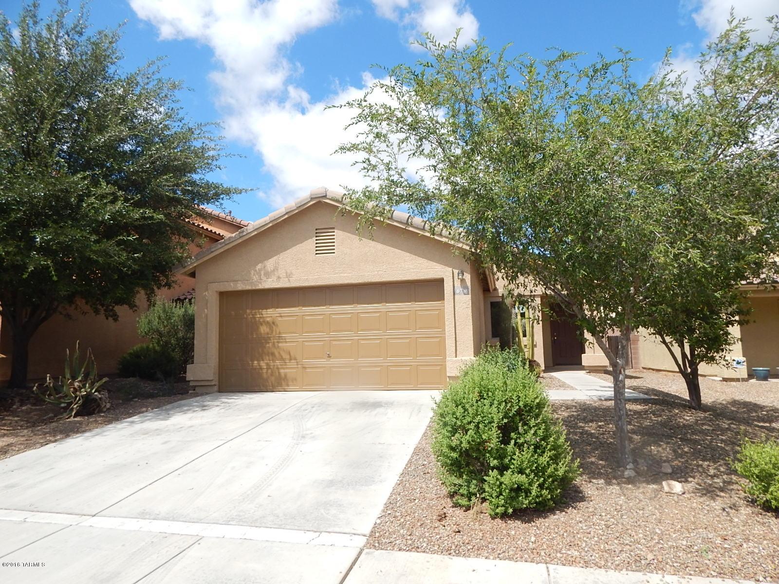 This is a Fannie Mae HomePath property. With 1094 sq ft of living space this home has 3 bedrooms, 2 bathrooms, spacious kitchen with dining/breakfast area, 2 car garage, & backyard with covered patio. <FONT COLOR=RED> Recently painted interior with two tone paint, installed NEW carpet, NEW oven/stove, NEW dishwasher & New Microwave. </FONT> Located close to I-19, shopping, restaurants, schools and much more! Attention First Time Buyers: complete the HomePath Ready Buyer homeownership course. Attach certificate to offer and request up to 3% closing cost assistance. Ask Agent for more details. Restrictions apply.