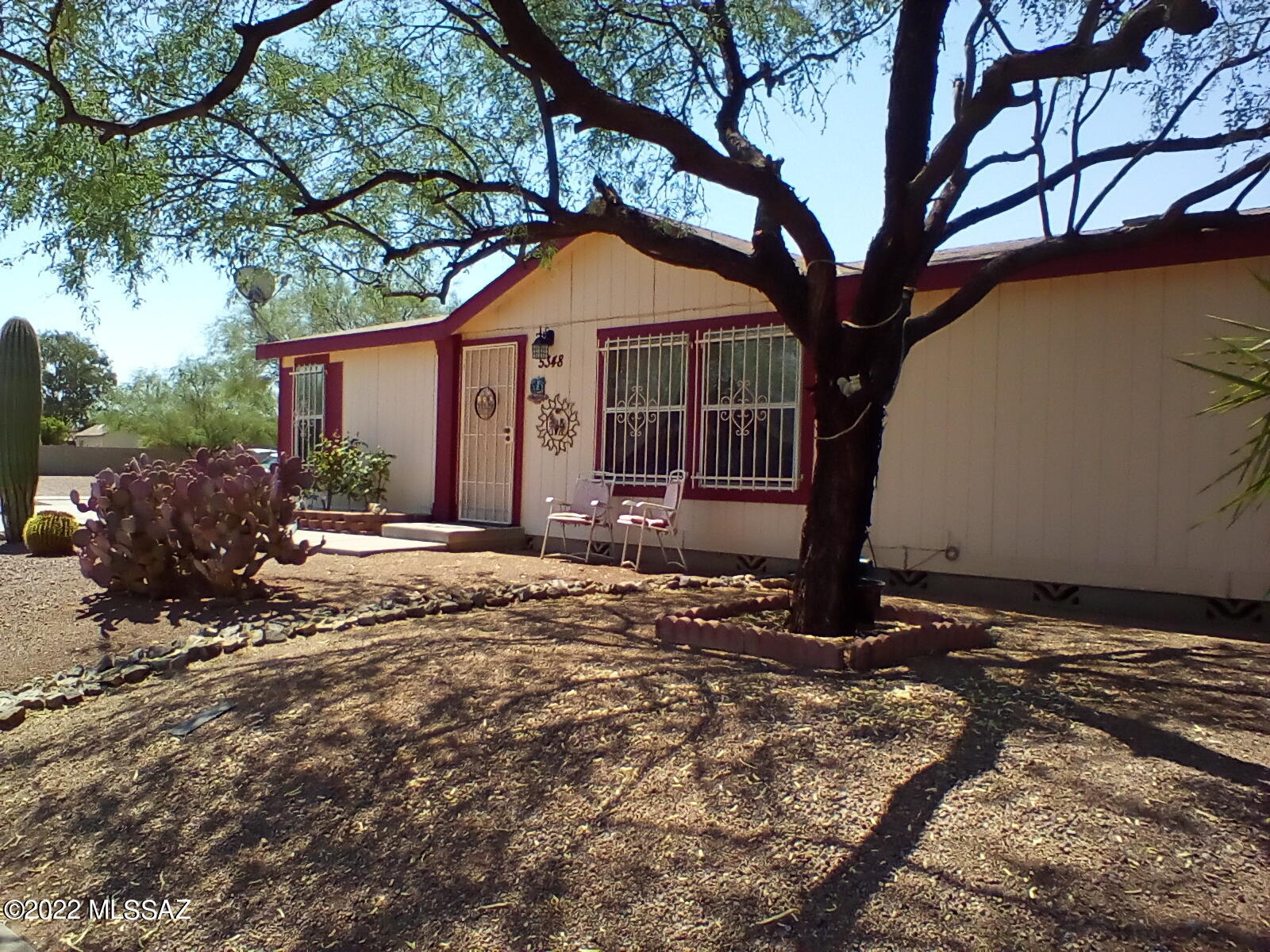 Large 3 br 2 ba home on a large lot in a quiet, well-kept neighborhood.  Split bedroom floor plan, high ceilings and security doors are just a few of the things this great home has to offer.  The backyard has irrigation and plenty of space for a beautiful garden or large trees.  Detached 2 car garage AND a storage shop!  Beautiful views of the mountains.   20 minutes to downtown and 15 minutes from Casino Del Sol.