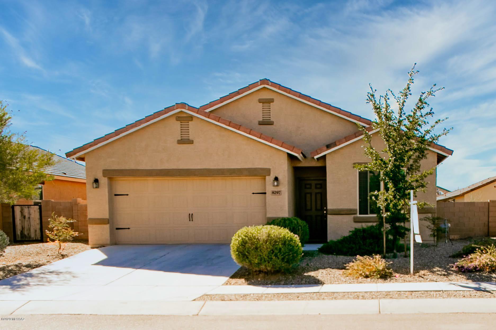 This beautiful home comes with upgrades including energy efficient kitchen appliances, spacious granite countertops, custom wood cabinets, brushed nickel hardware and an attached two car garage. This floor plan also showcases a master suite complete with a walk-in closet, as well as a separate dining room, a fully fenced backyard with a blockwall, covered patio and front yard landscaping. The Sonoran Ranch community offers a plethora of amenities including miles of walking trails, as well as a park with a children's playground and a spacious picnic area. The amenity-rich community and hassle-free home provide an extraordinary lifestyle for you and your family.